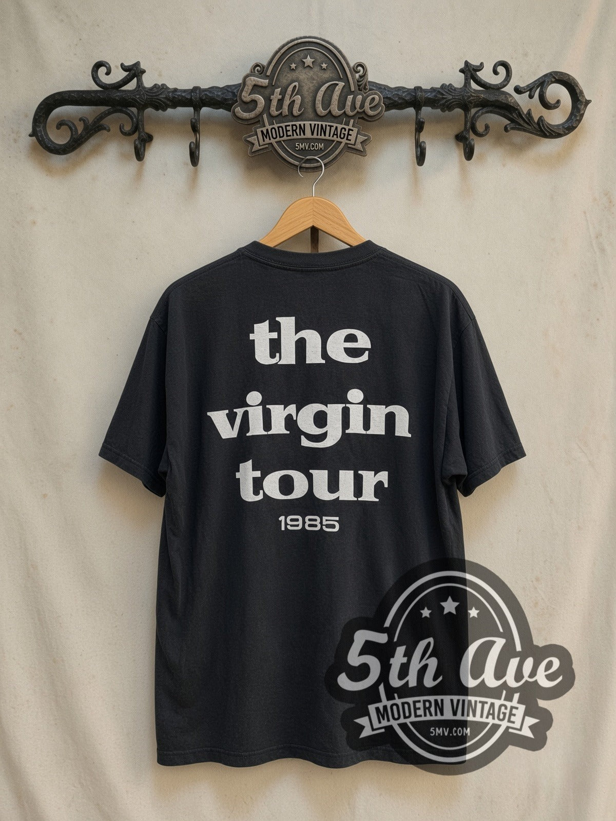 Madonna The Virgin Tour' 1985 vintage band t-shirt in black, back view on a display rack