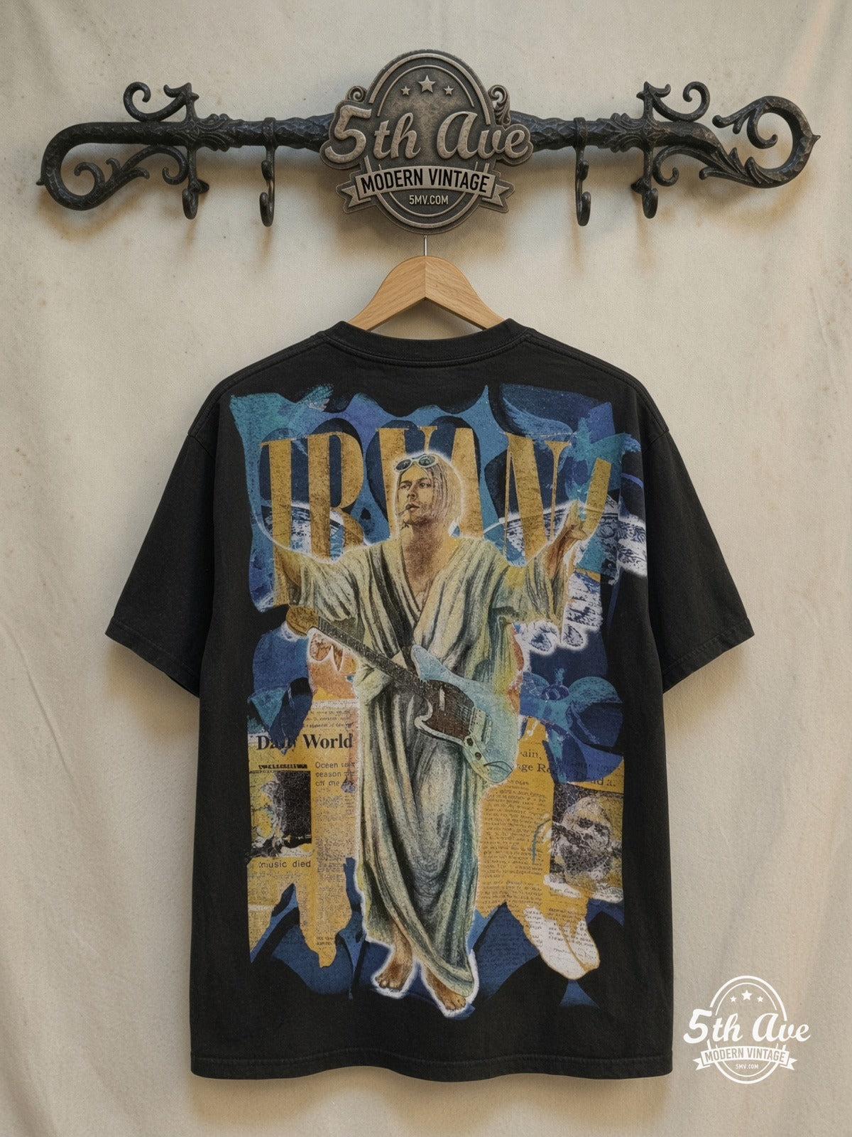 Nirvana – Kurt Cobain Overprint – Vintage Band T-Shirt — back on locked cream ornate 5th Ave rack