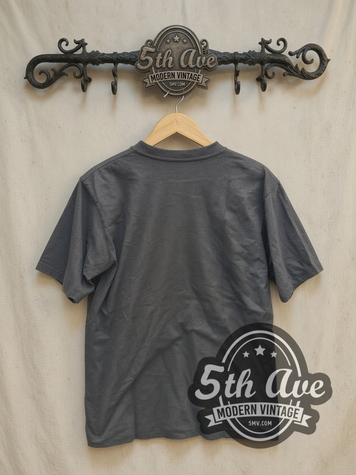 Red Hot Chili Peppers Classic Red Asterisk Circle Logo vintage band t-shirt, back view on a display rack