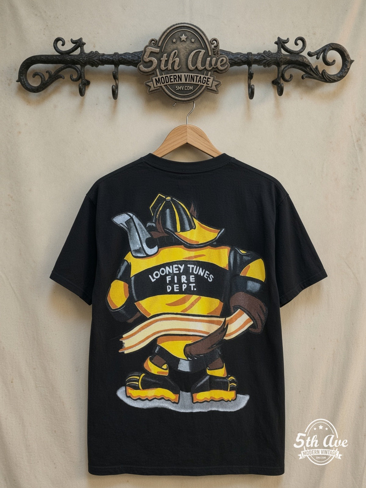 Looney Tunes Taz-Mania Fire Department all-over-print graphic tee, back view on a display rack