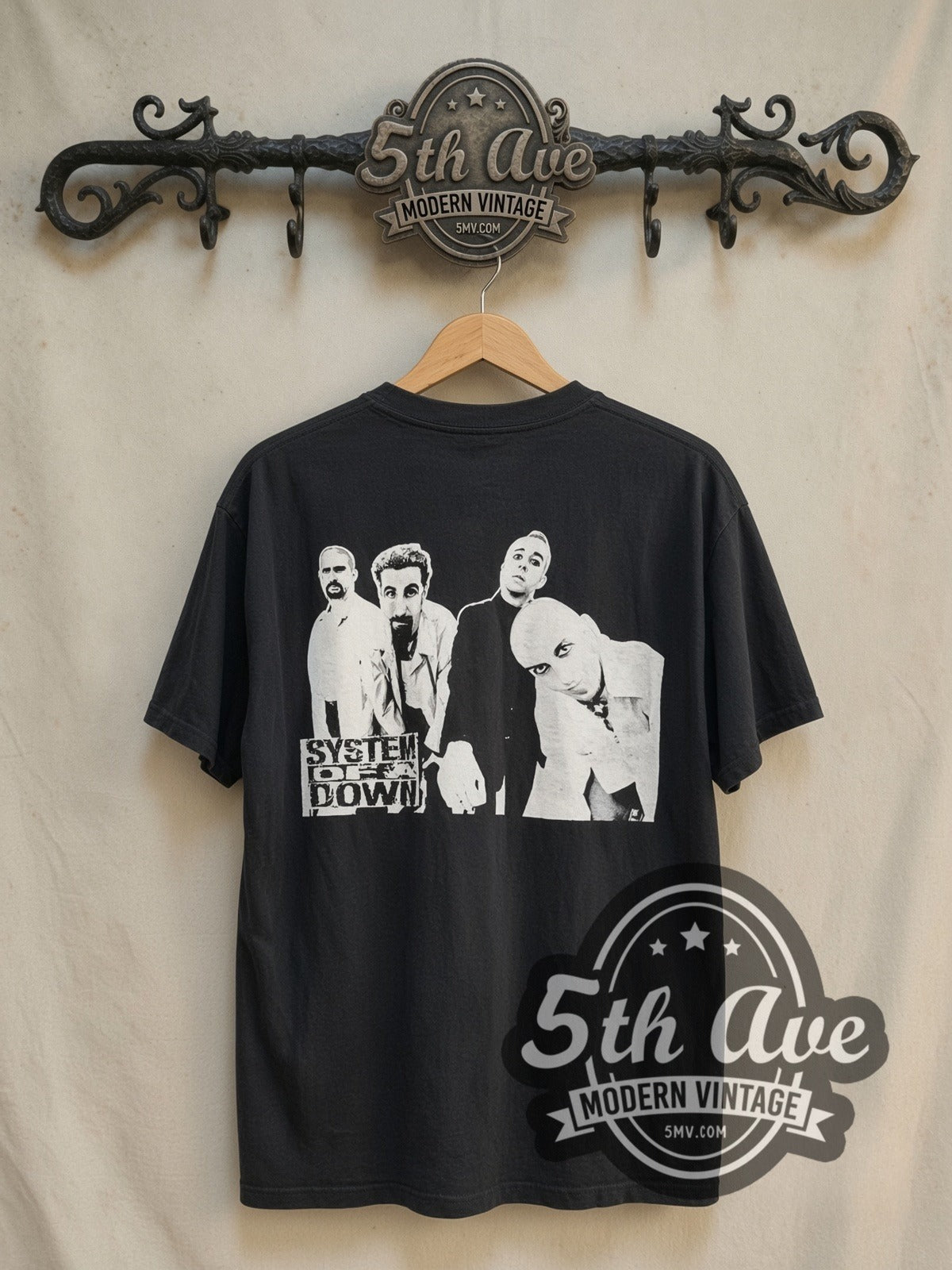 System of a Down Genocide vintage band t-shirt in black, back view on a display rack