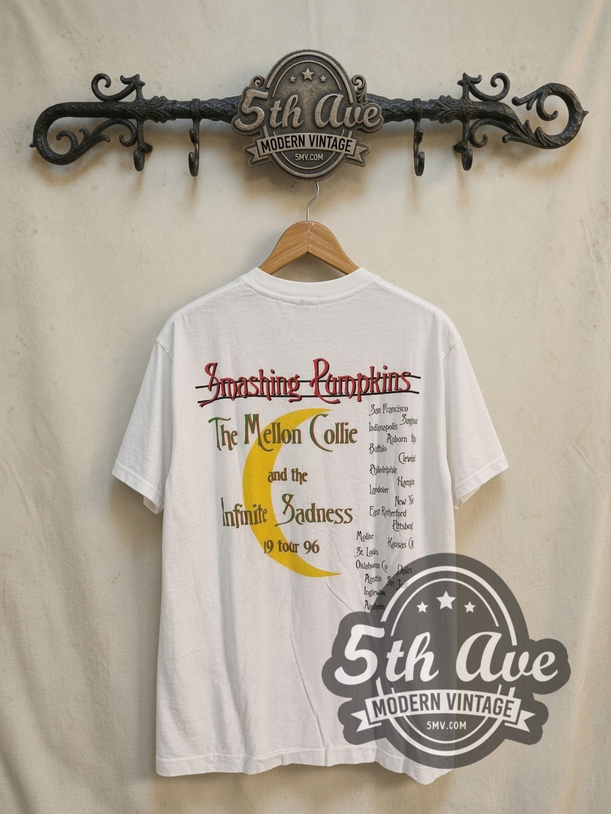 The Smashing Pumpkins Mellon Collie and the Infinite Sadness 1996 Tour vintage band t-shirt, back view on a display rack