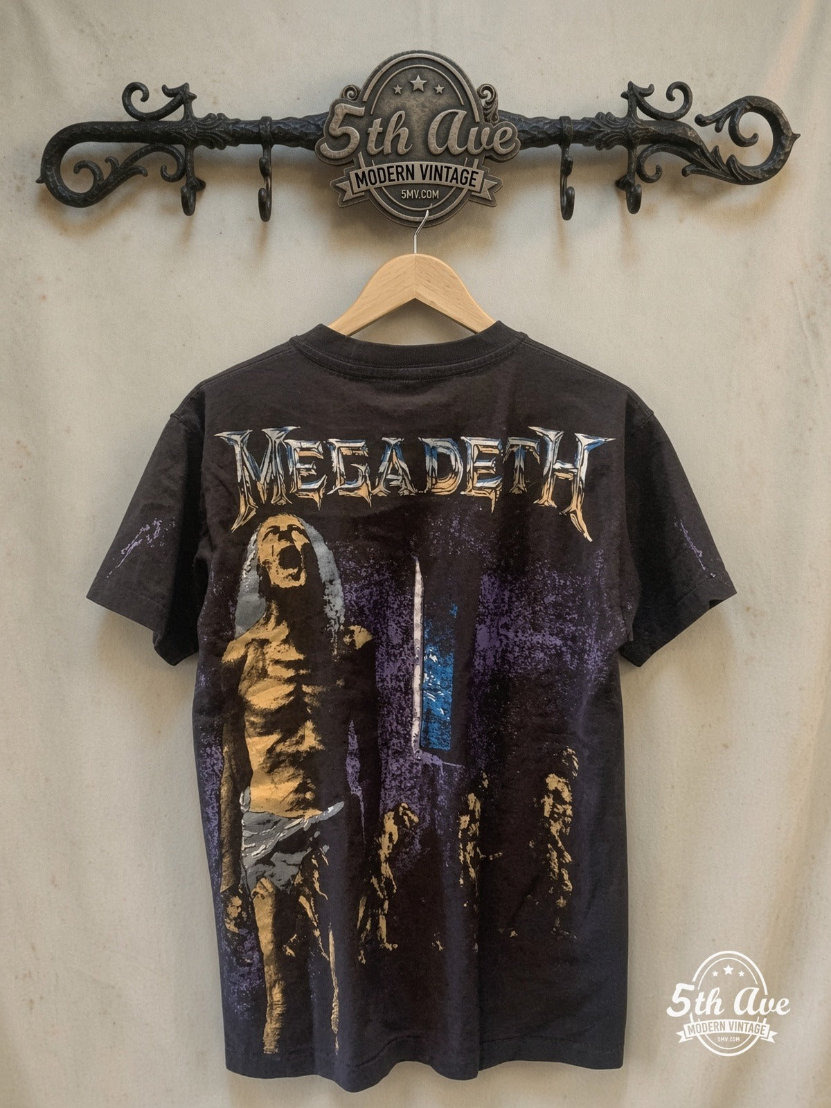 Megadeth – OVERPRINT – Vintage Band T-Shirt — back on locked cream ornate 5th Ave rack
