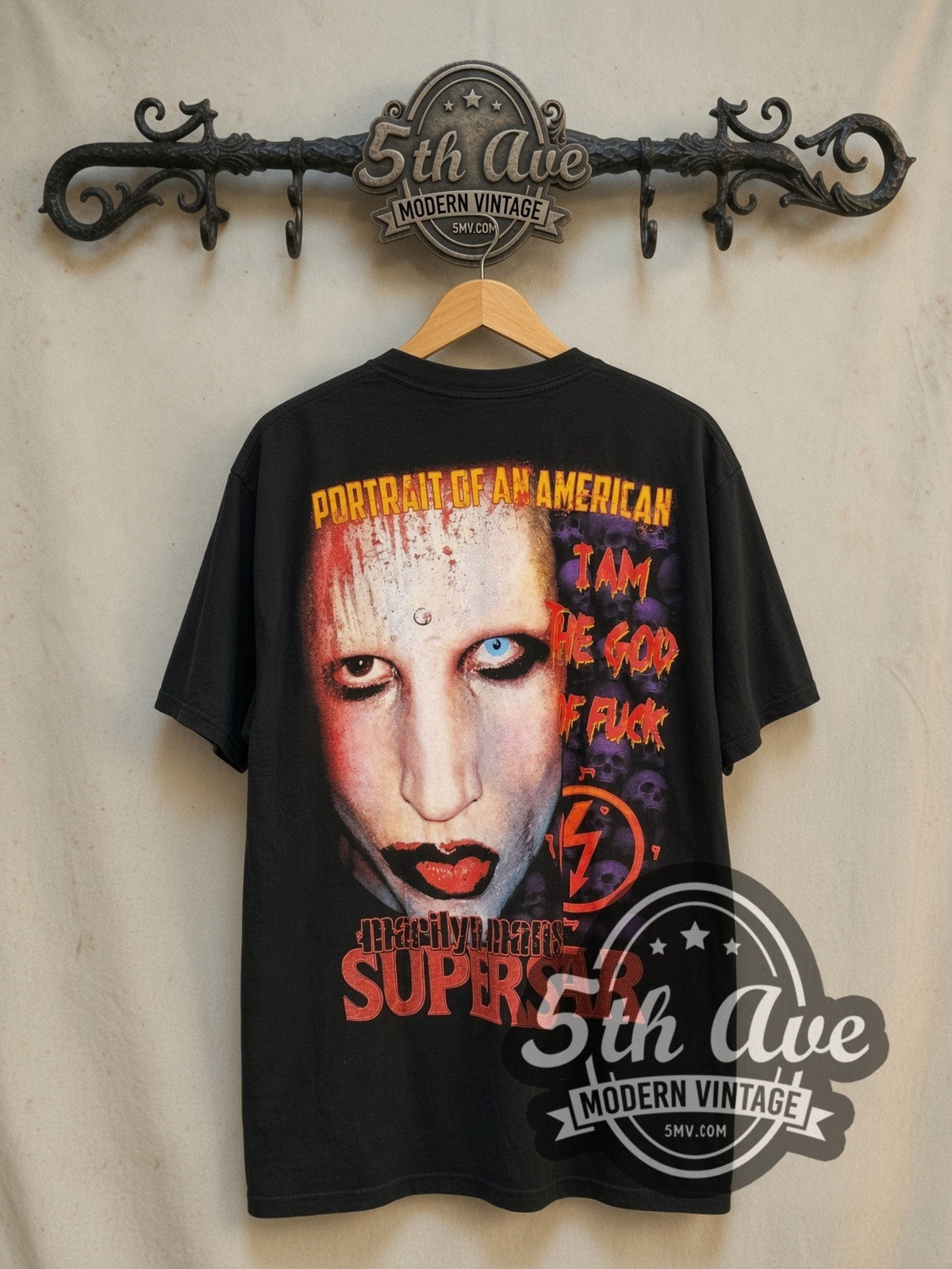 Marilyn Manson Antichrist Superstar Prayer Hands Skulls vintage band t-shirt, back view on a display rack