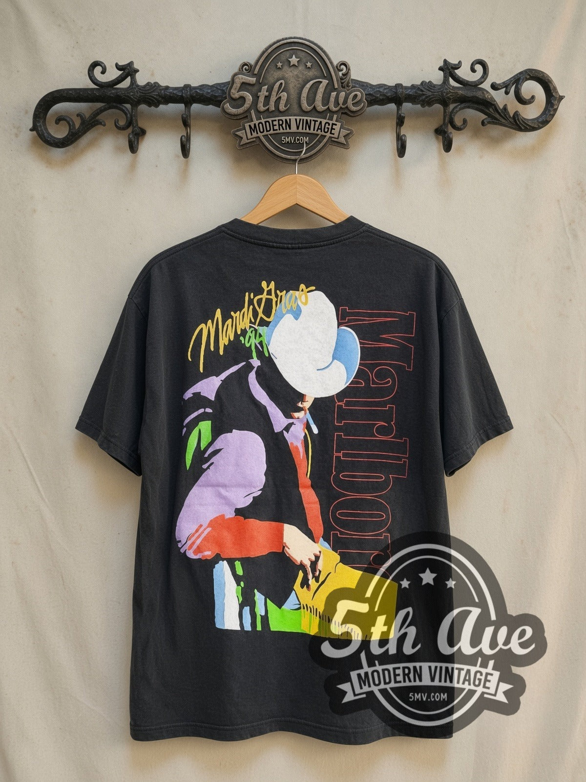 Marlboro Mardi Gras 1994 graphic tee in black, back view on a display rack