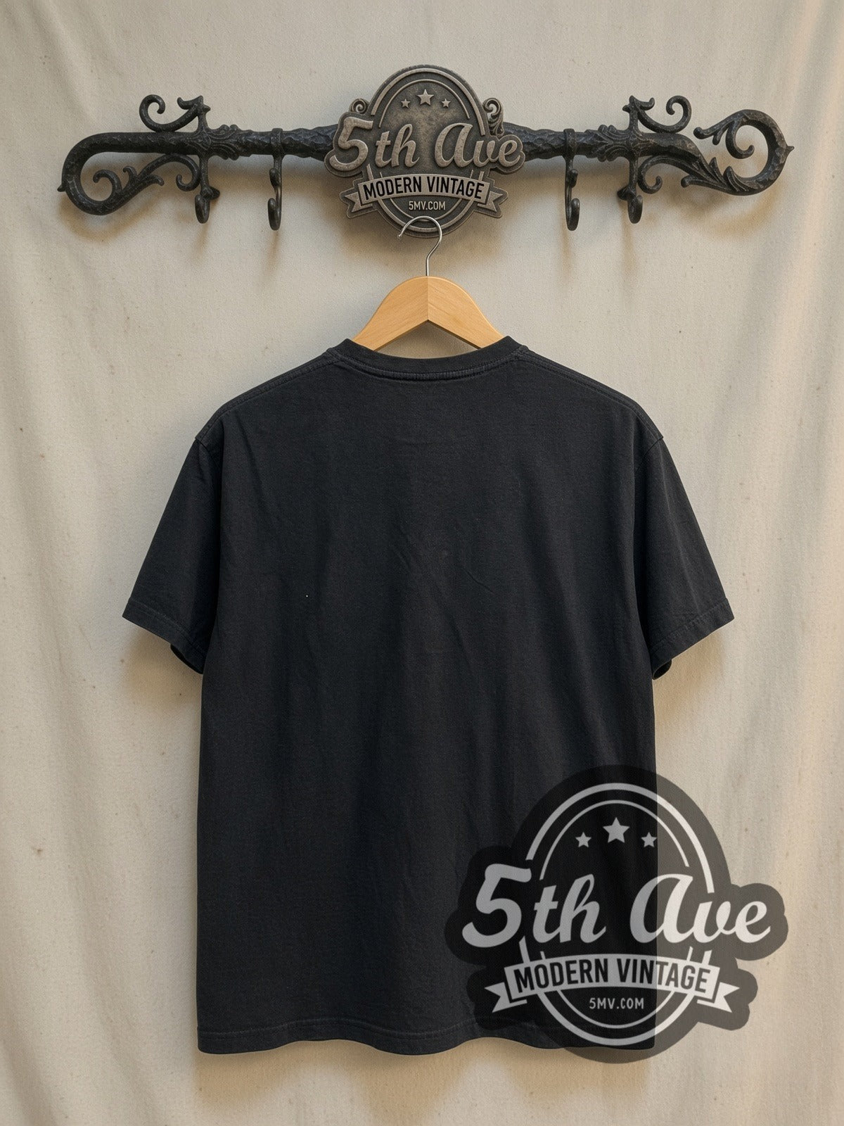 The Cure Boys Don't Cry vintage band t-shirt, back view on a display rack