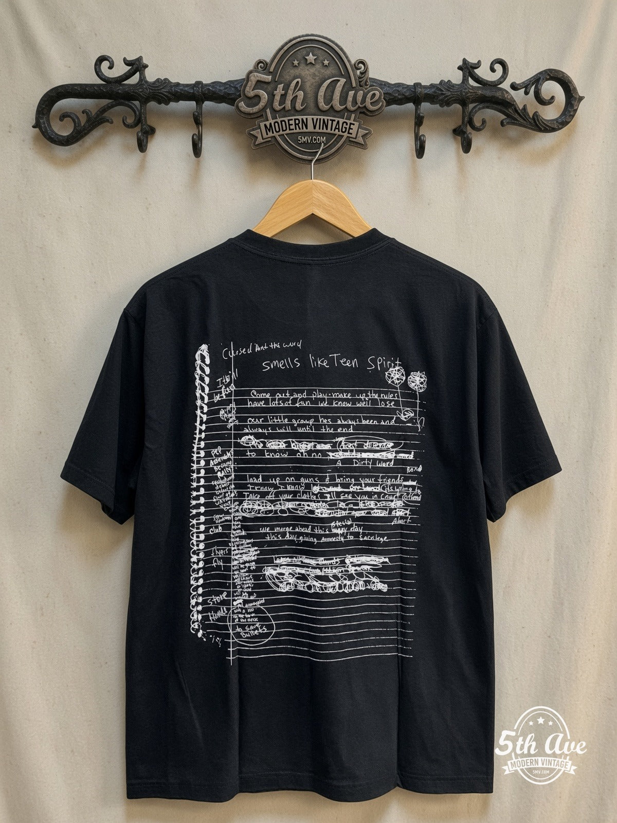 Nirvana – Kurt Cobain Film Strip Pink Signature – Vintage Band T-Shirt — back on locked cream ornate 5th Ave rack