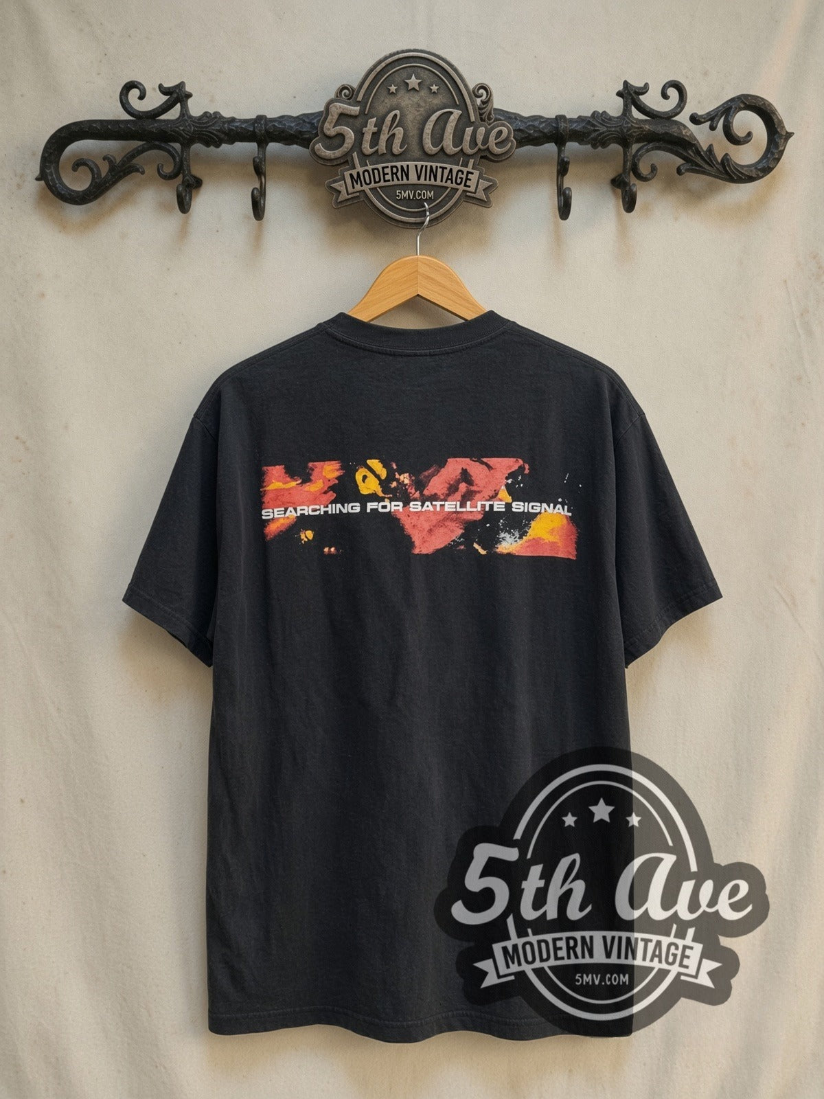System of a Down Searching For A Satellite Signal vintage band t-shirt in black, back view on a display rack