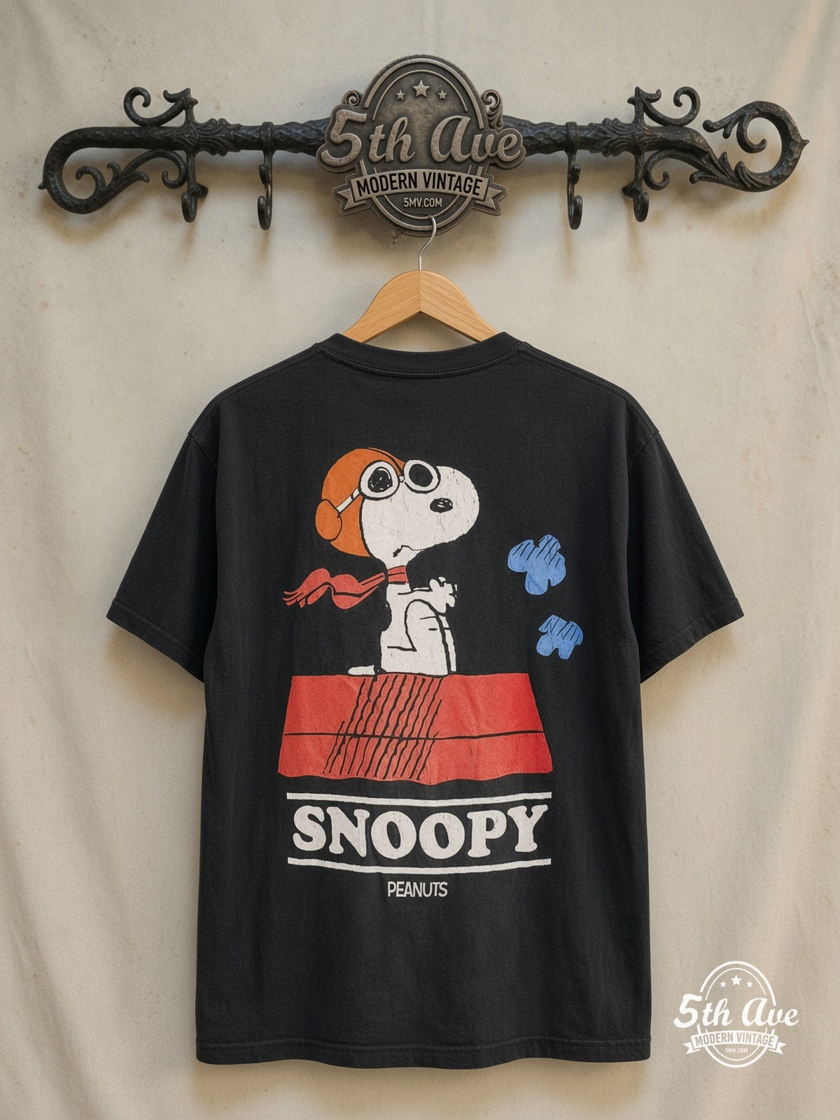 Peanuts – Snoopy Trust Me I'm a Pilot – New Vintage Graphic Tee — back on locked cream ornate 5th Ave rack