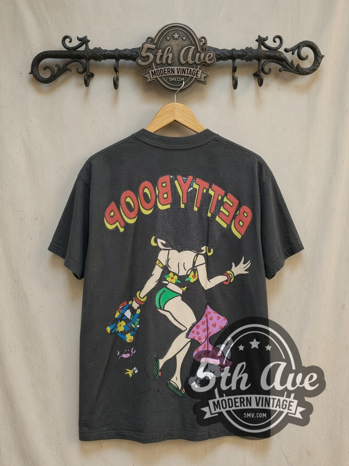 Betty Boop Beach Vibes vintage cartoon t-shirt Vintage Glamour graphic tee, back view on a display rack
