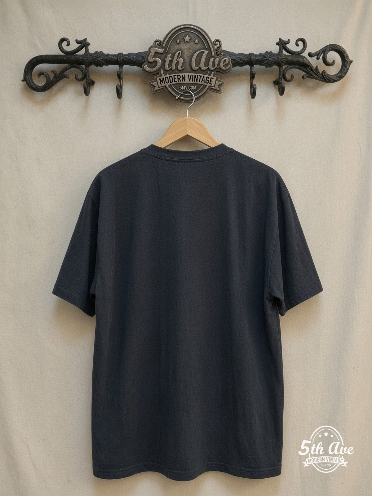 The Cure – Four Member Photo White Script – Vintage Band T-Shirt — back on locked cream ornate 5th Ave rack