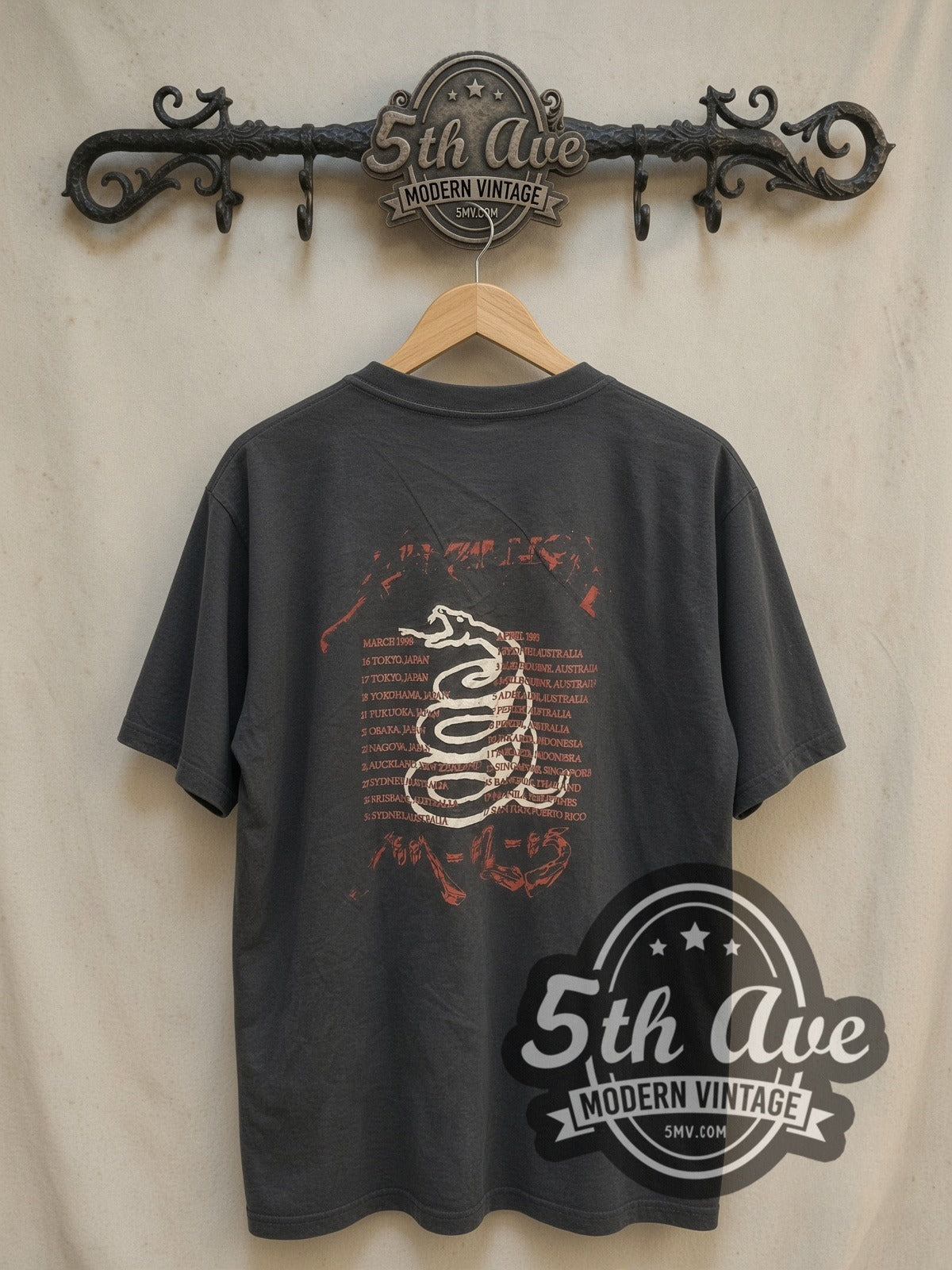 Metallica Faces and World Tour 'Don't Tread On Me' Snake vintage band t-shirt, back view on a display rack