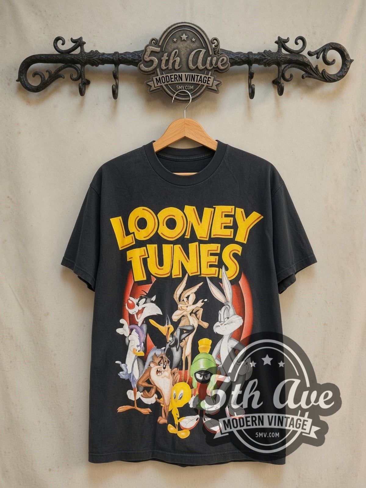 Looney Tunes Bugs Bunny and Friends vintage cartoon tee in black, front view on a display rack