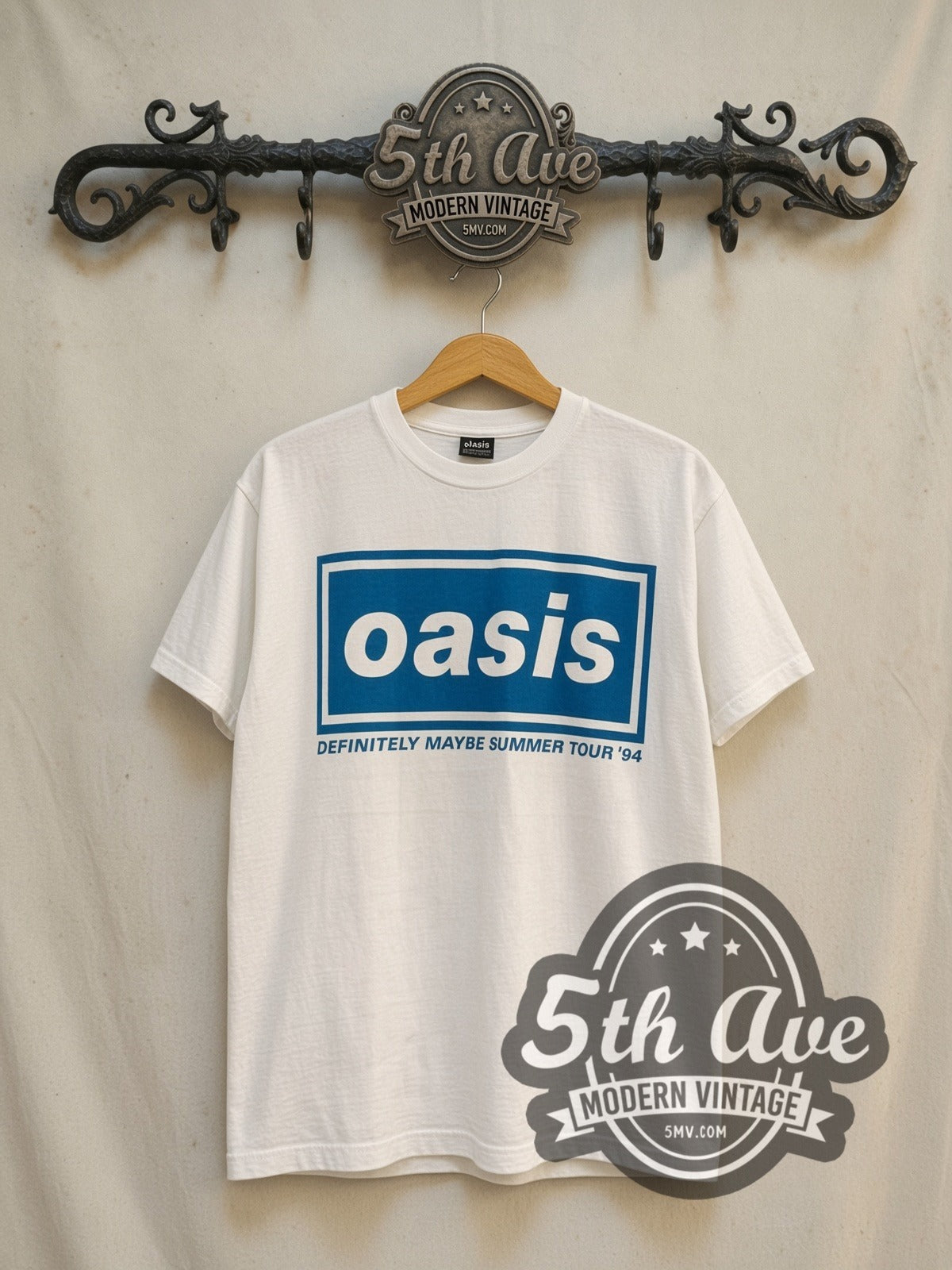 Oasis Definitely Maybe Summer Tour 1994 vintage band t-shirt in white, front view on a display rack