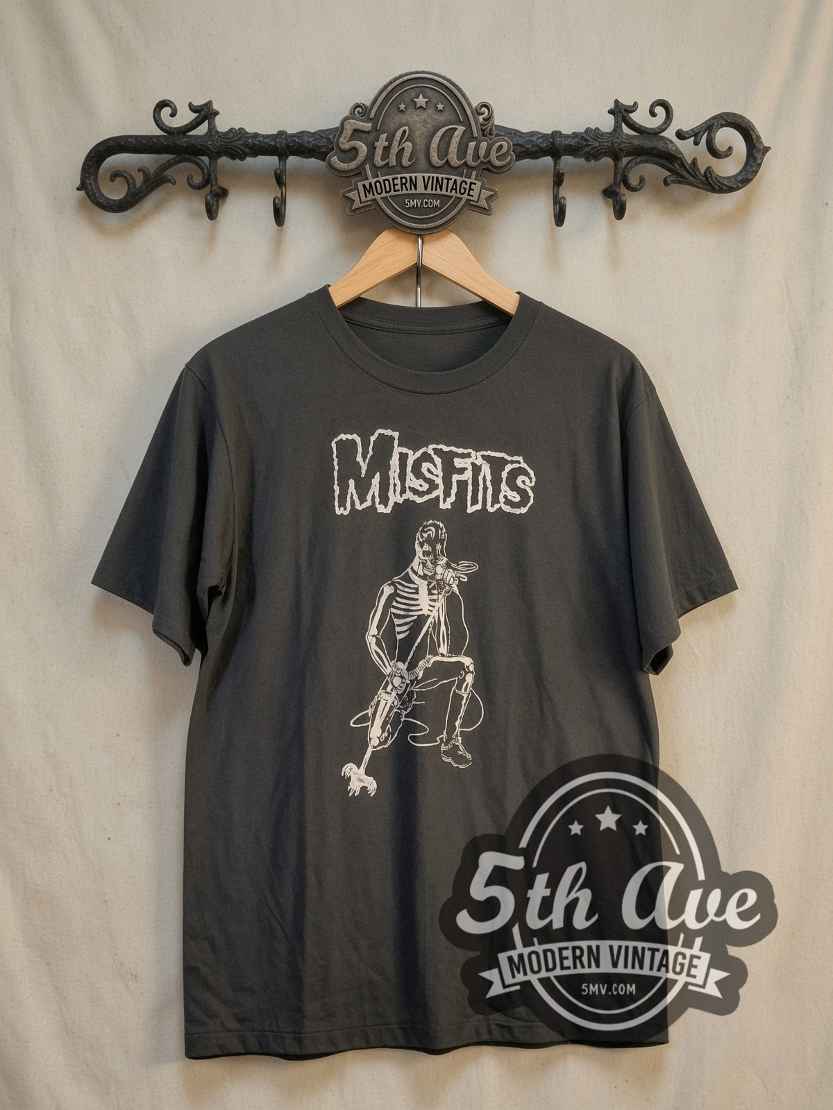 Misfits Kneeling Fiend with Microphone vintage band t-shirt, front view on a display rack