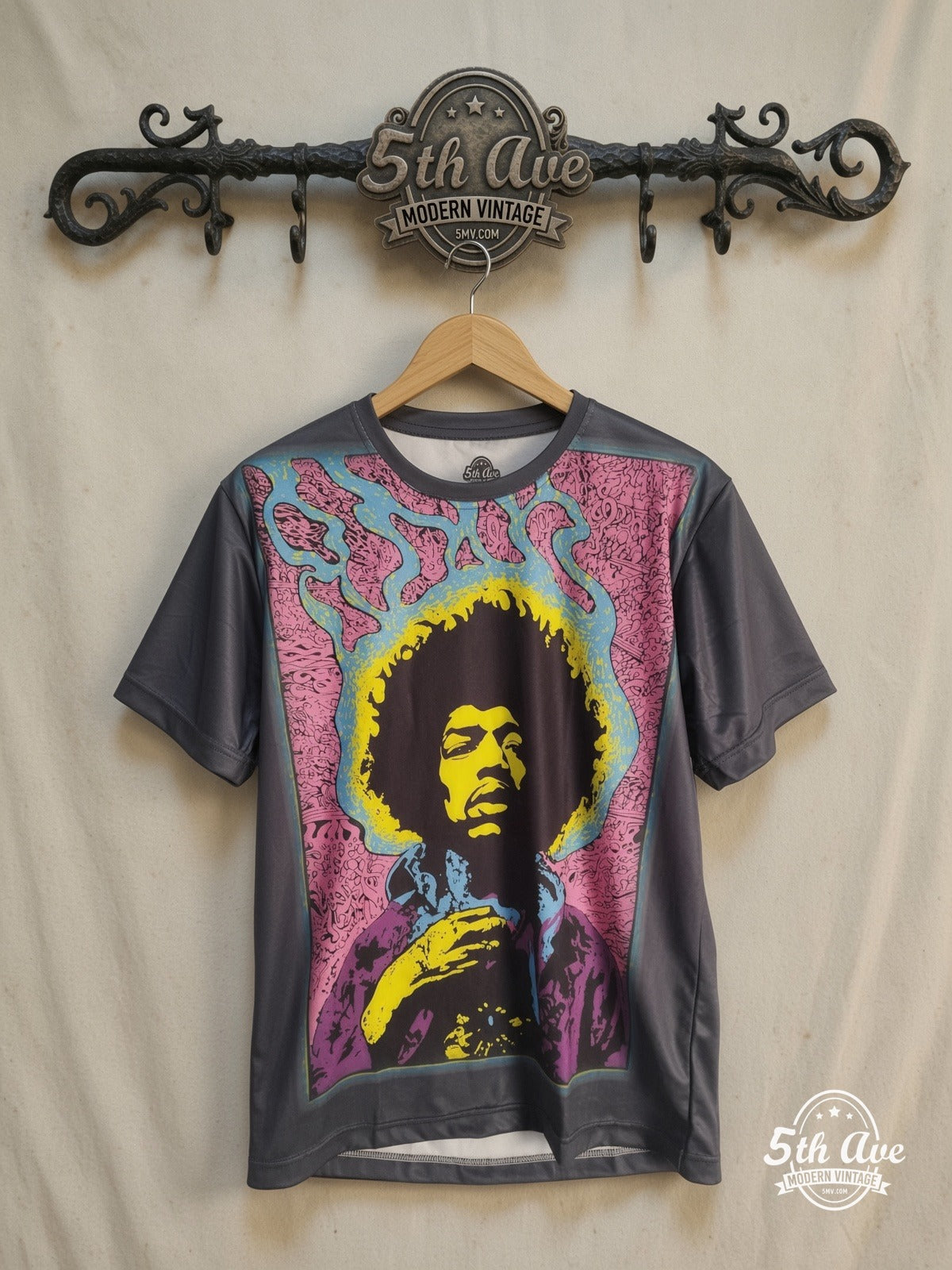 Jimi Hendrix – Psychedelic Yellow Portrait Pink Frame – Vintage Band T-Shirt — front on locked cream ornate 5th Ave rack