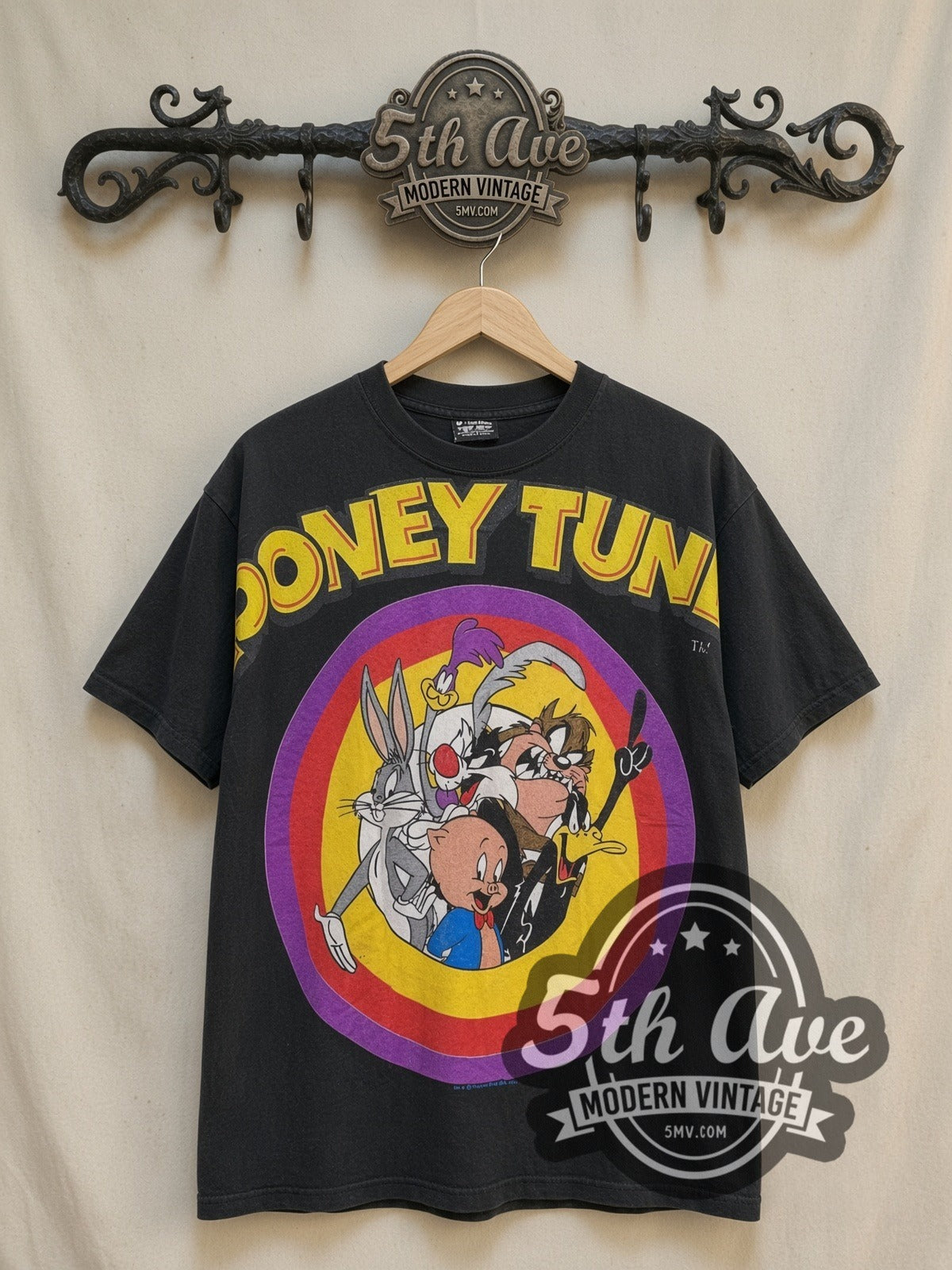 Looney Tunes TuneSquad vintage cartoon tee, front view on a display rack