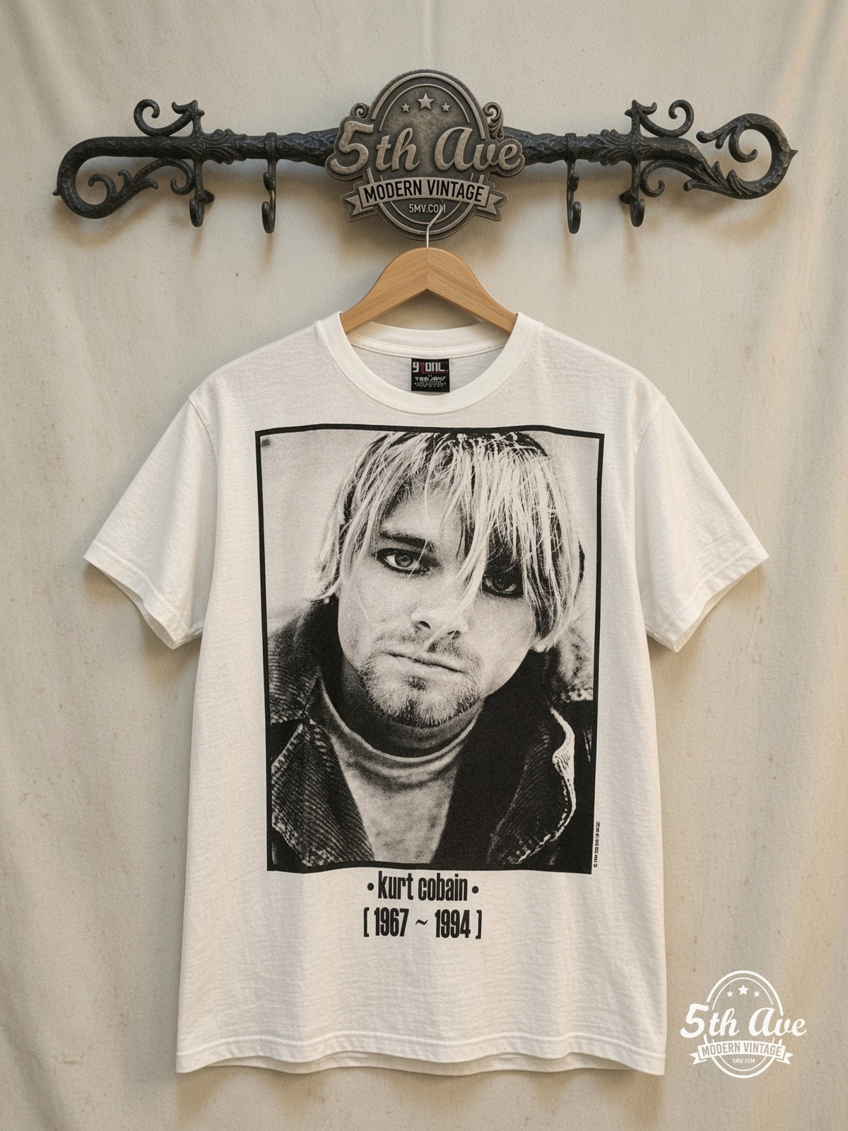 Nirvana – Classic Rock Band Graphic – Vintage Band T-Shirt — front on locked cream ornate 5th Ave rack