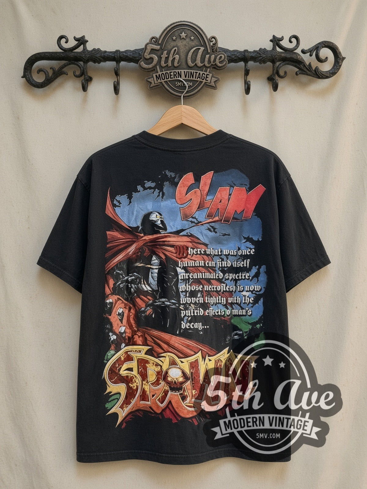 Spider-Man Marvel Studios Face Collage vintage graphic t-shirt, front view on a display rack