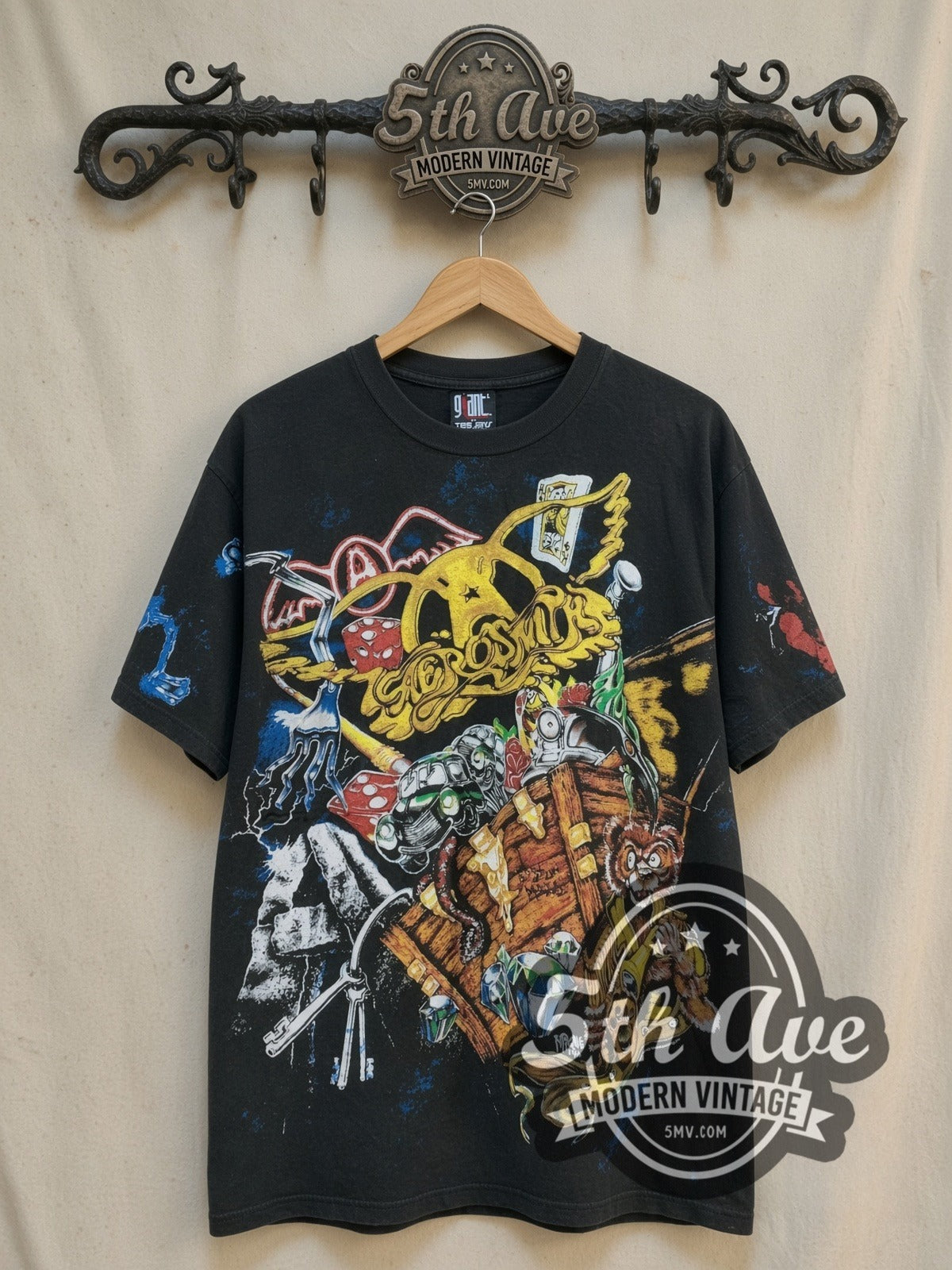 Aerosmith's Rockin' Journey all-over-print vintage band t-shirt, front view on a display rack
