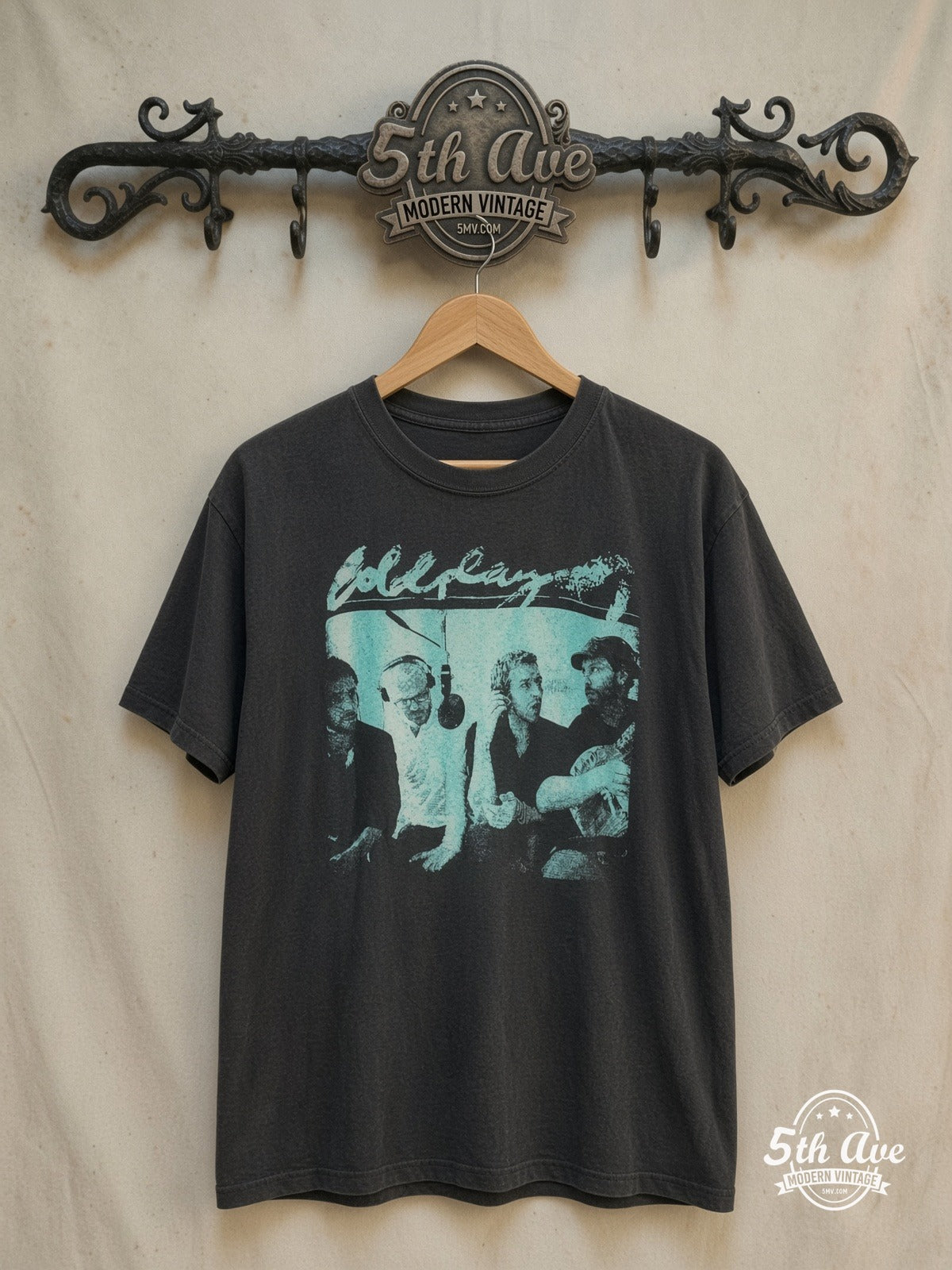Coldplay Studio Jam Session vintage band t-shirt, front view on a display rack