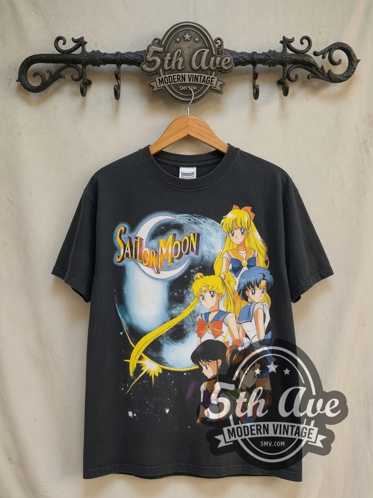 Sailor Moon Sailor Guardians and Starlights vintage graphic t-shirt, front view on a display rack