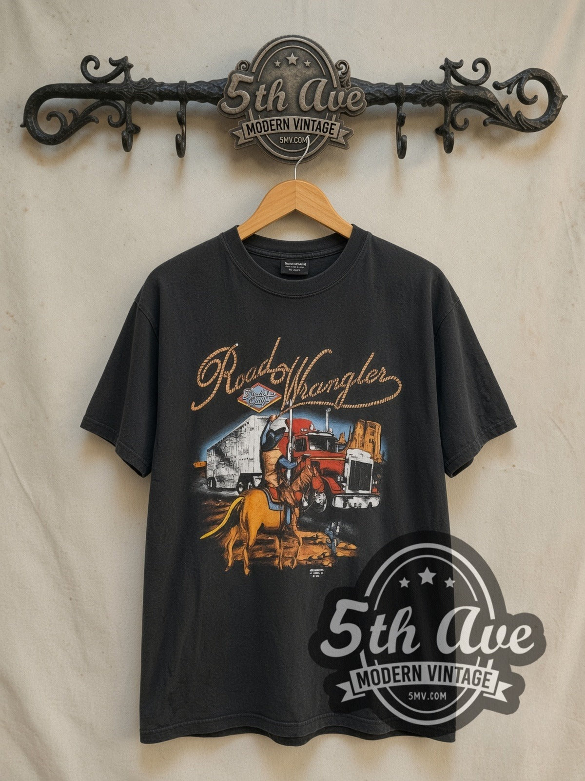 Road Wrangler Truckers Only Big Sioux Truck Stop vintage graphic tee in black, front view on a display rack