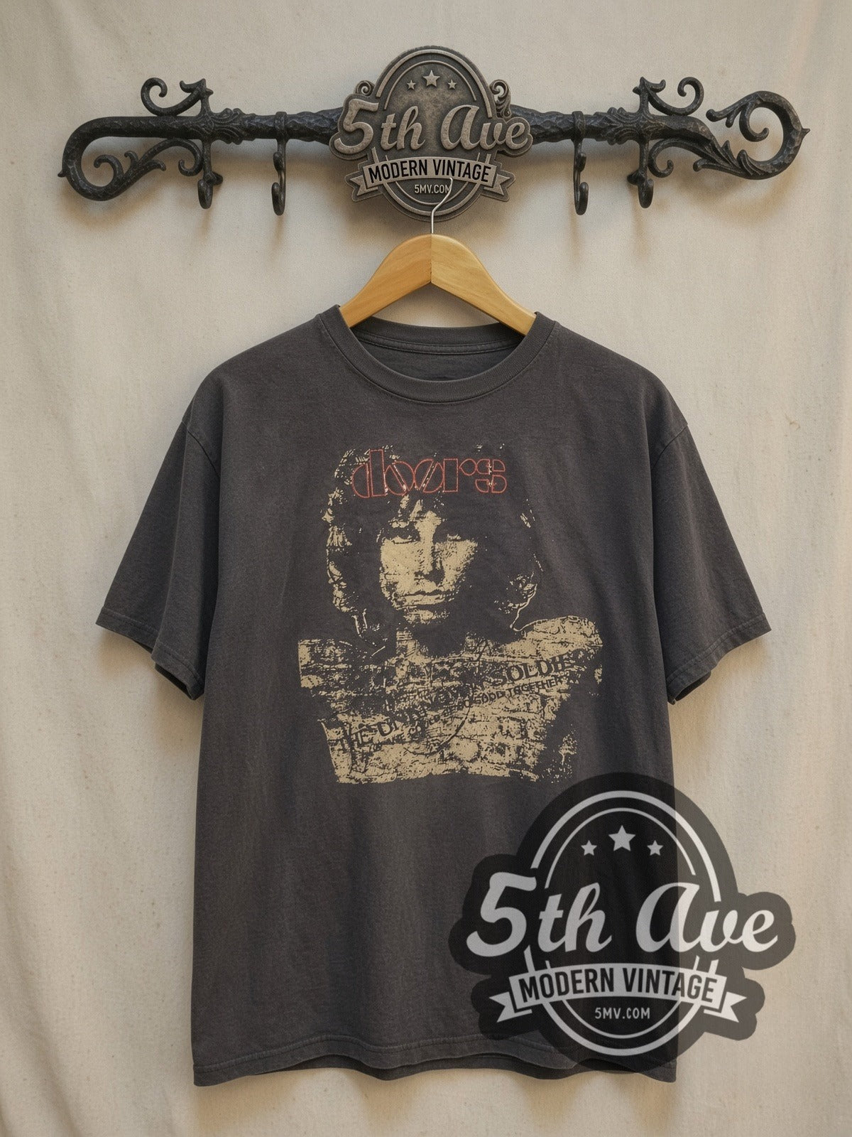 The Doors Jim Morrison Portrait vintage band t-shirt, front view on a display rack