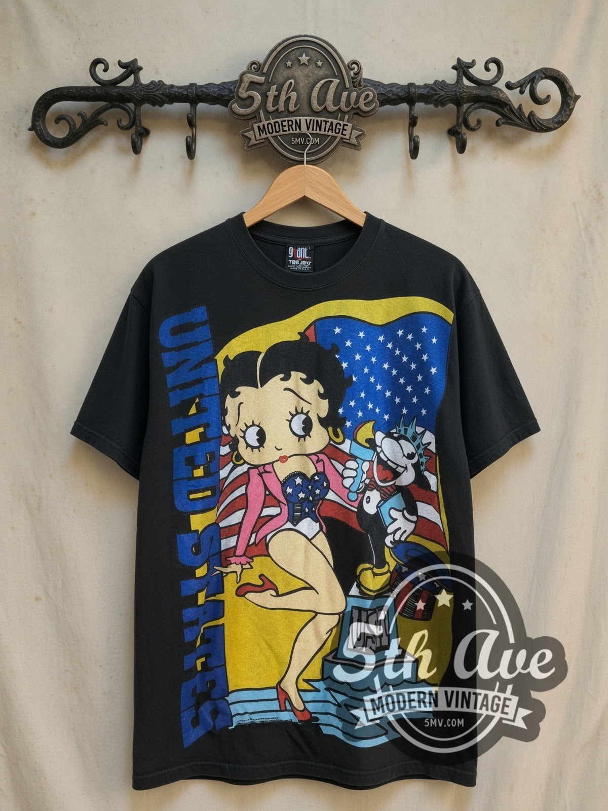 Betty Boop USA Graphic all-over-print vintage cartoon tee, front view on a display rack