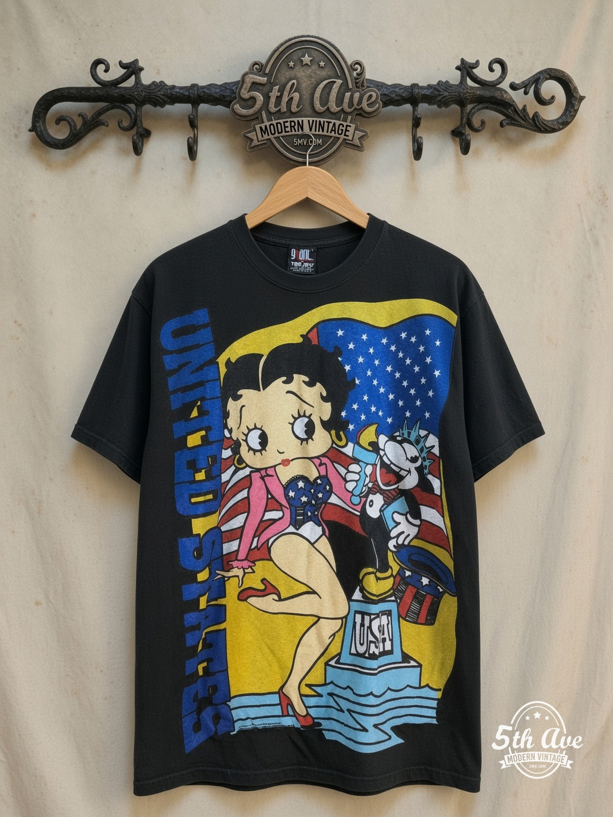 Betty Boop – USA Graphic – All Over Print – New Vintage Graphic Tee — front on locked cream ornate 5th Ave rack