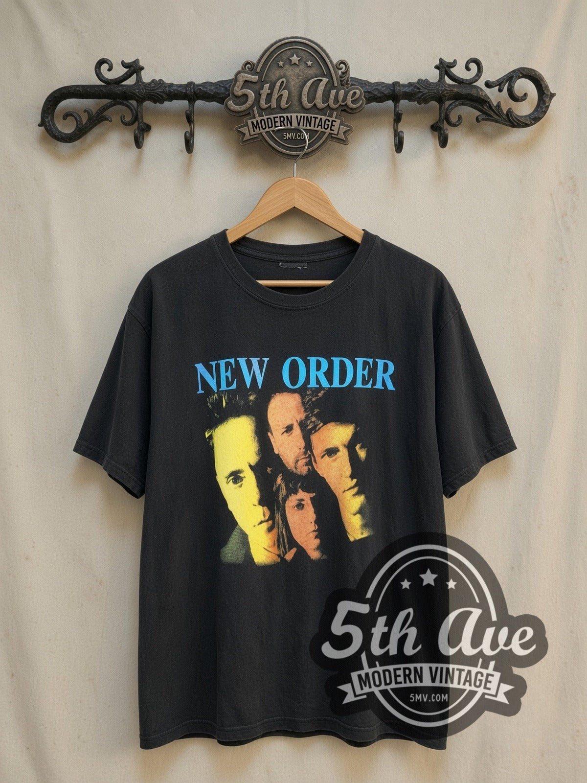 New Order Vibrant Collage vintage band t-shirt, front view on a display rack