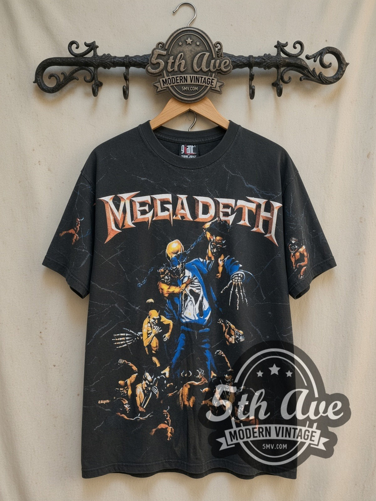 Megadeth Holy Wars Vic Rattlehead all-over-print vintage band t-shirt, front view on a display rack