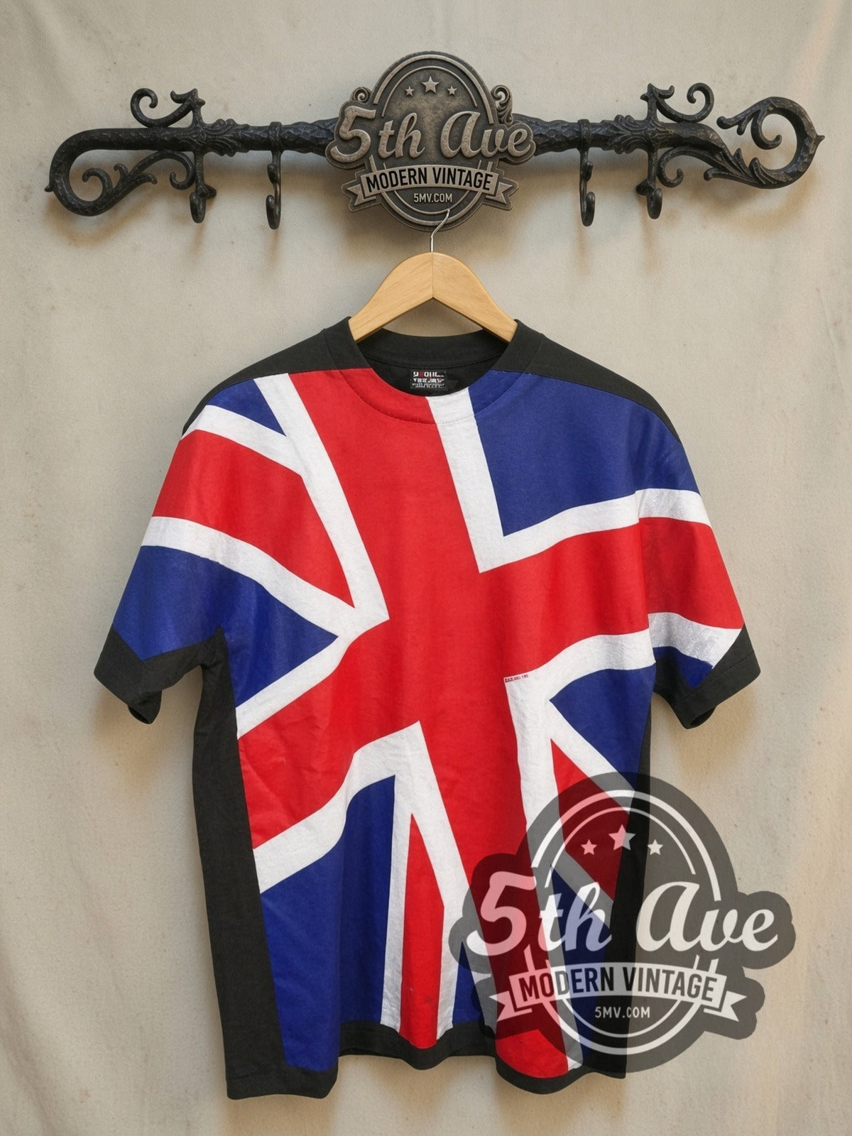 UK Union Jack Union Flag all-over-print vintage graphic tee, front view on a display rack