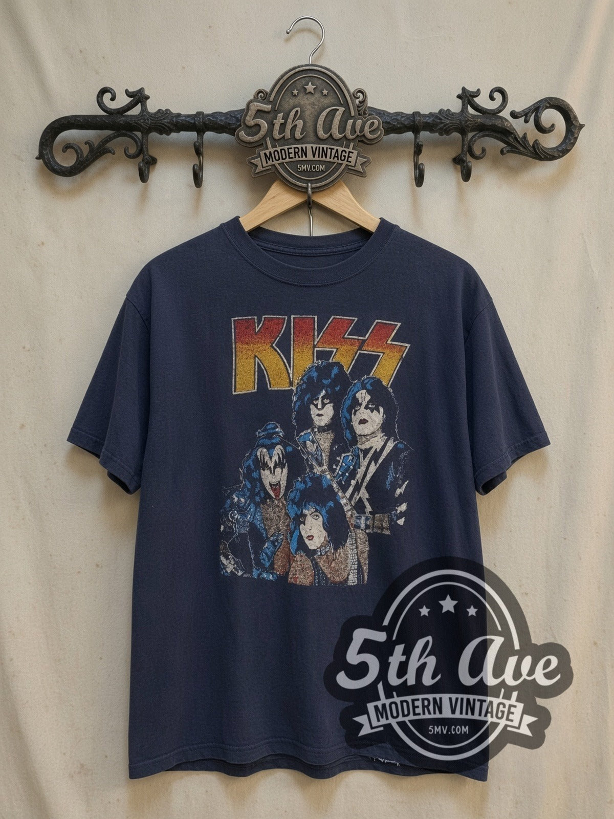 KISS Triple Logo vintage band t-shirt, front view on a display rack