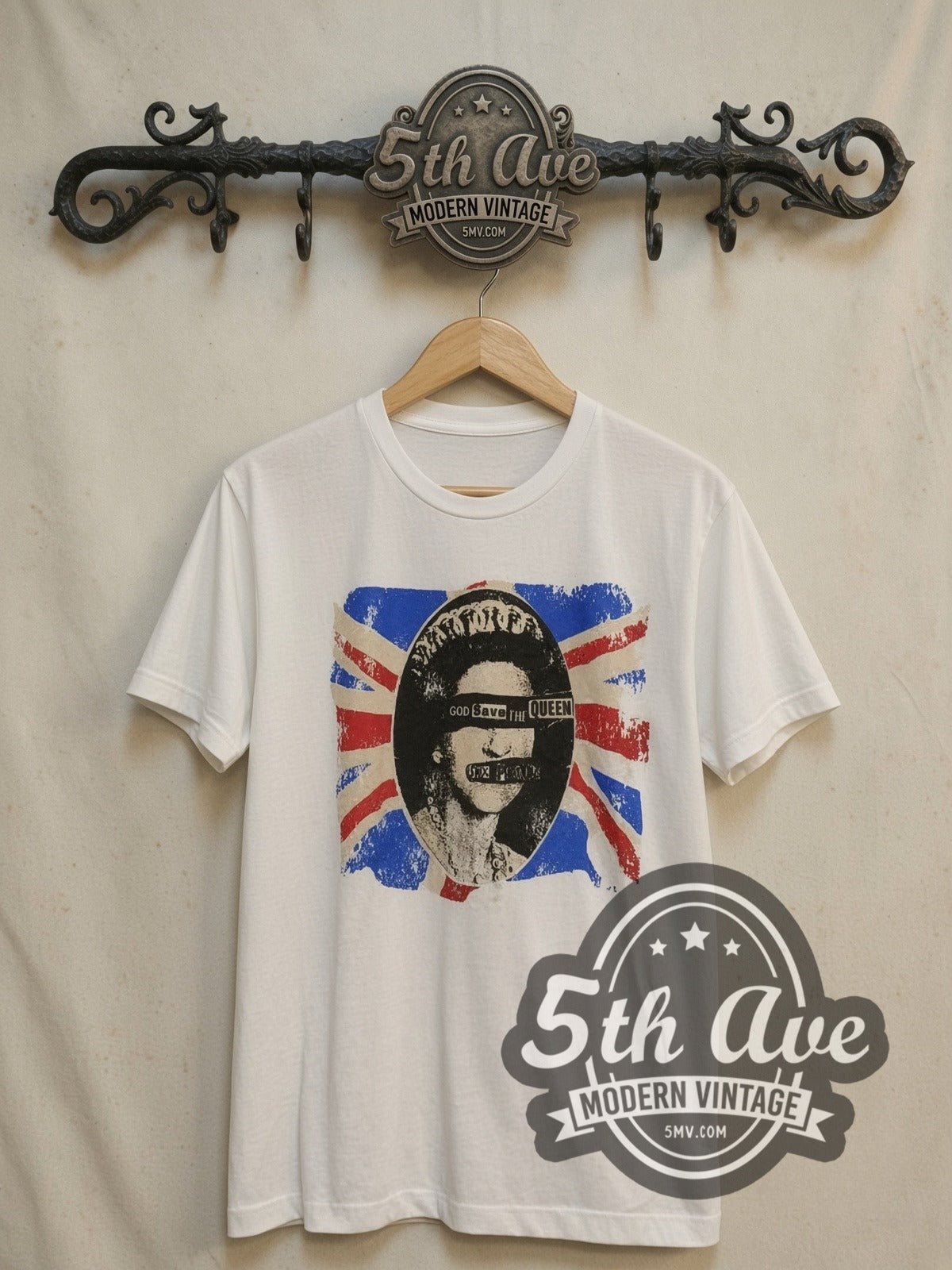 Sex Pistols God Save the Queen vintage band t-shirt, front view on a display rack
