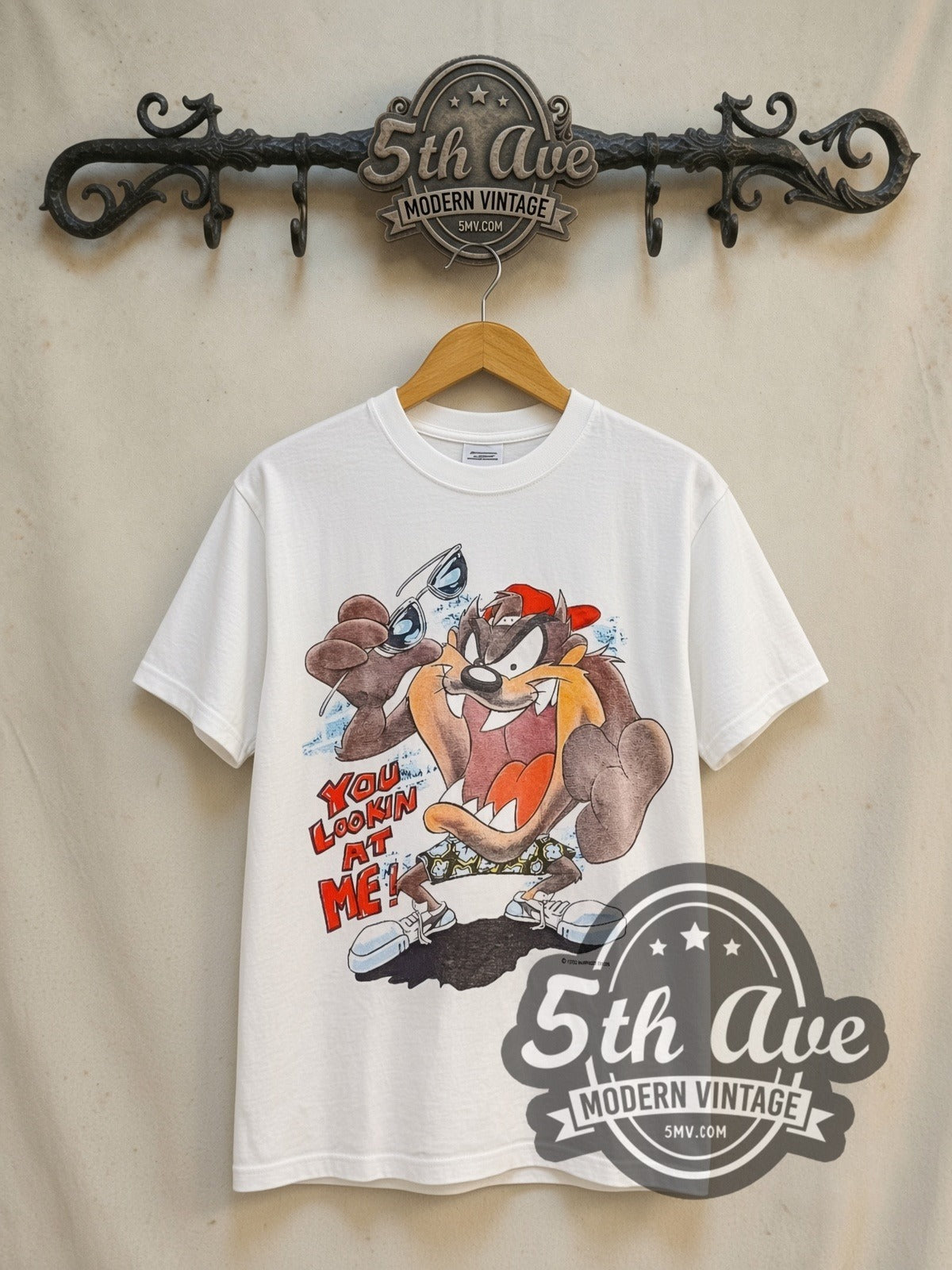 Looney Tunes Taz-Mania Skateboard vintage cartoon tee in white, front view on a display rack