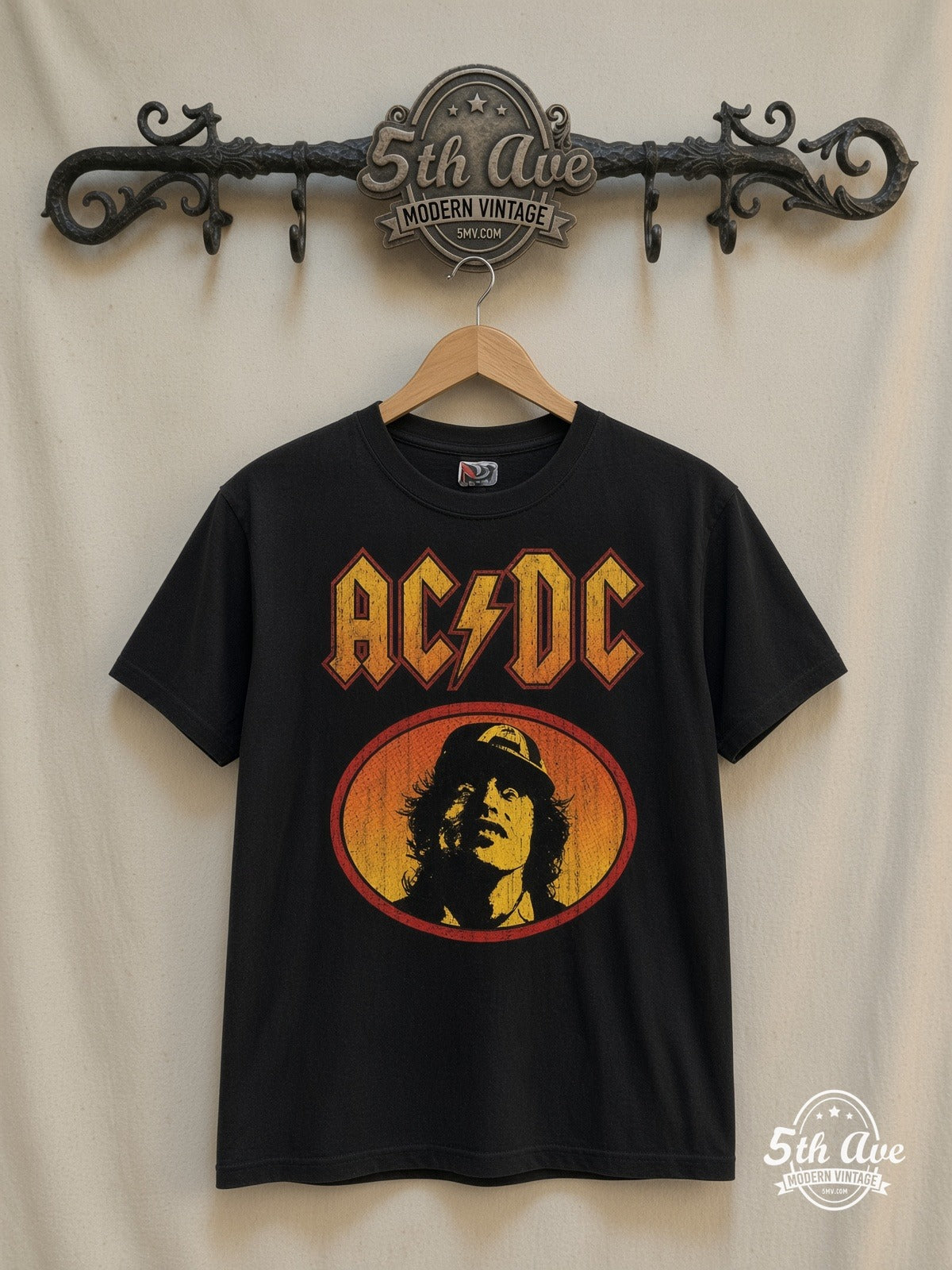 AC/DC – Angus Young Oval – Vintage Band T-Shirt — front on locked cream ornate 5th Ave rack
