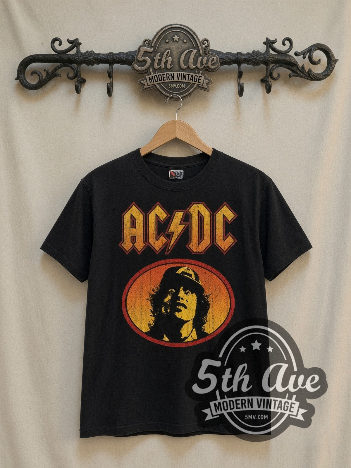 AC/DC Angus Young Oval vintage band t-shirt in black, front view on a display rack