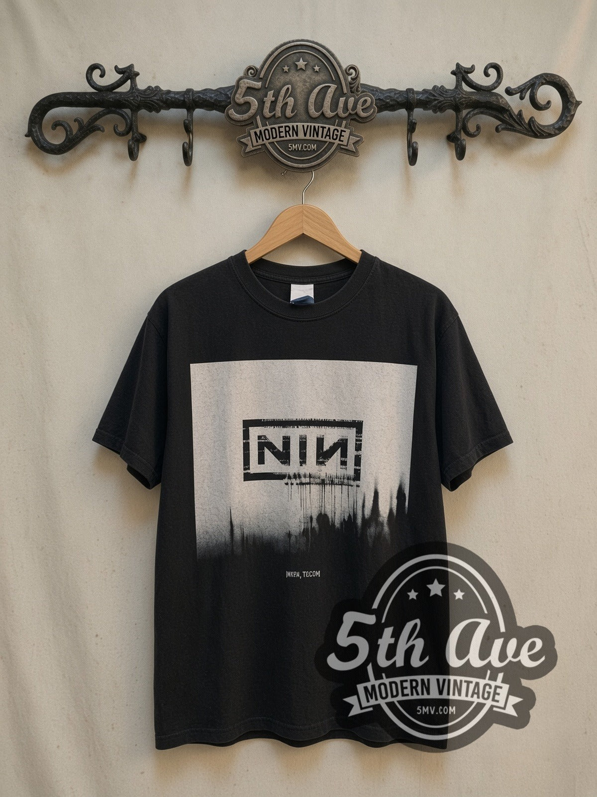 Nine Inch Nails vintage band t-shirt, front view on a display rack