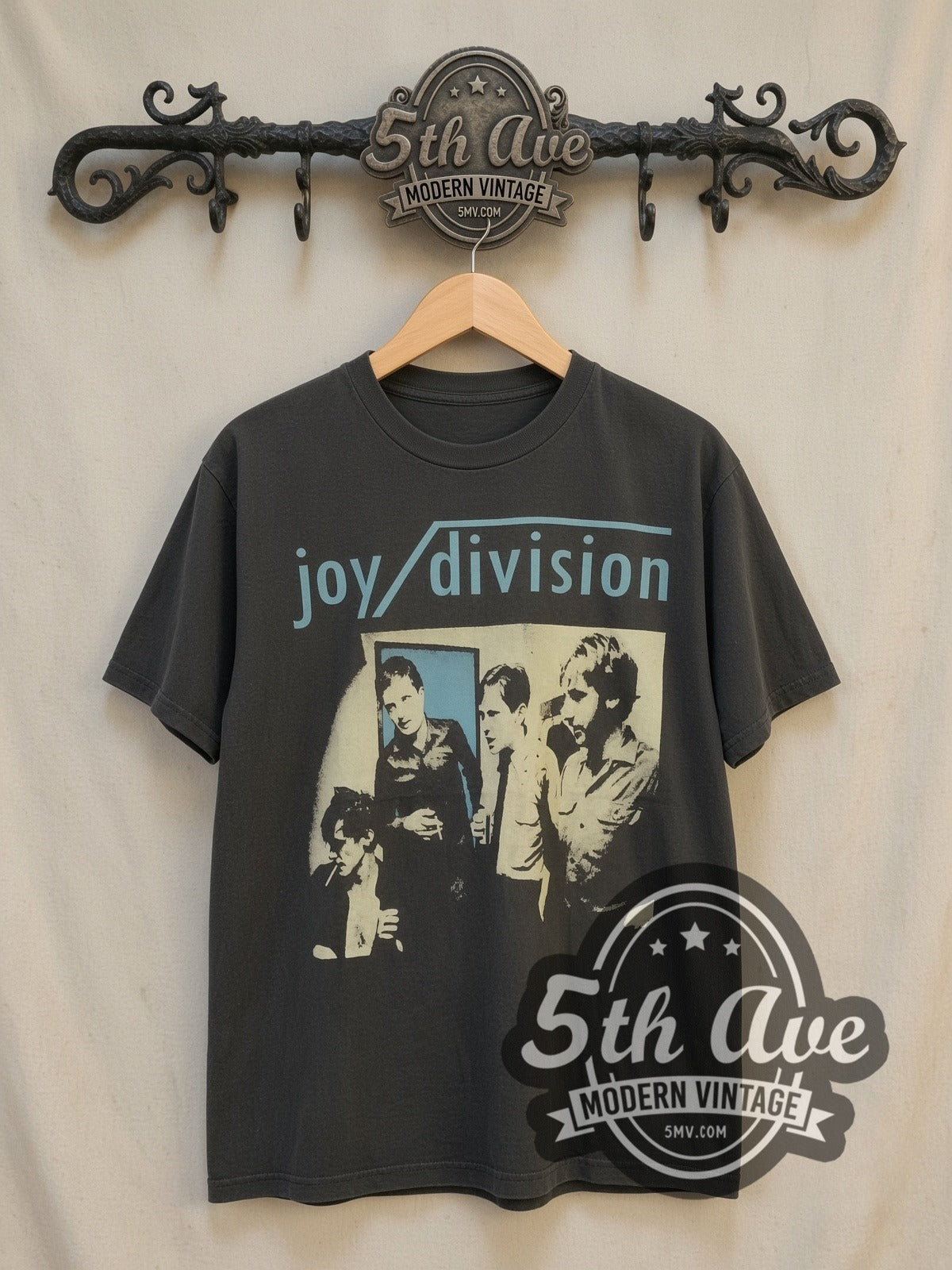 Joy Division Band Portrait vintage band t-shirt, front view on a display rack