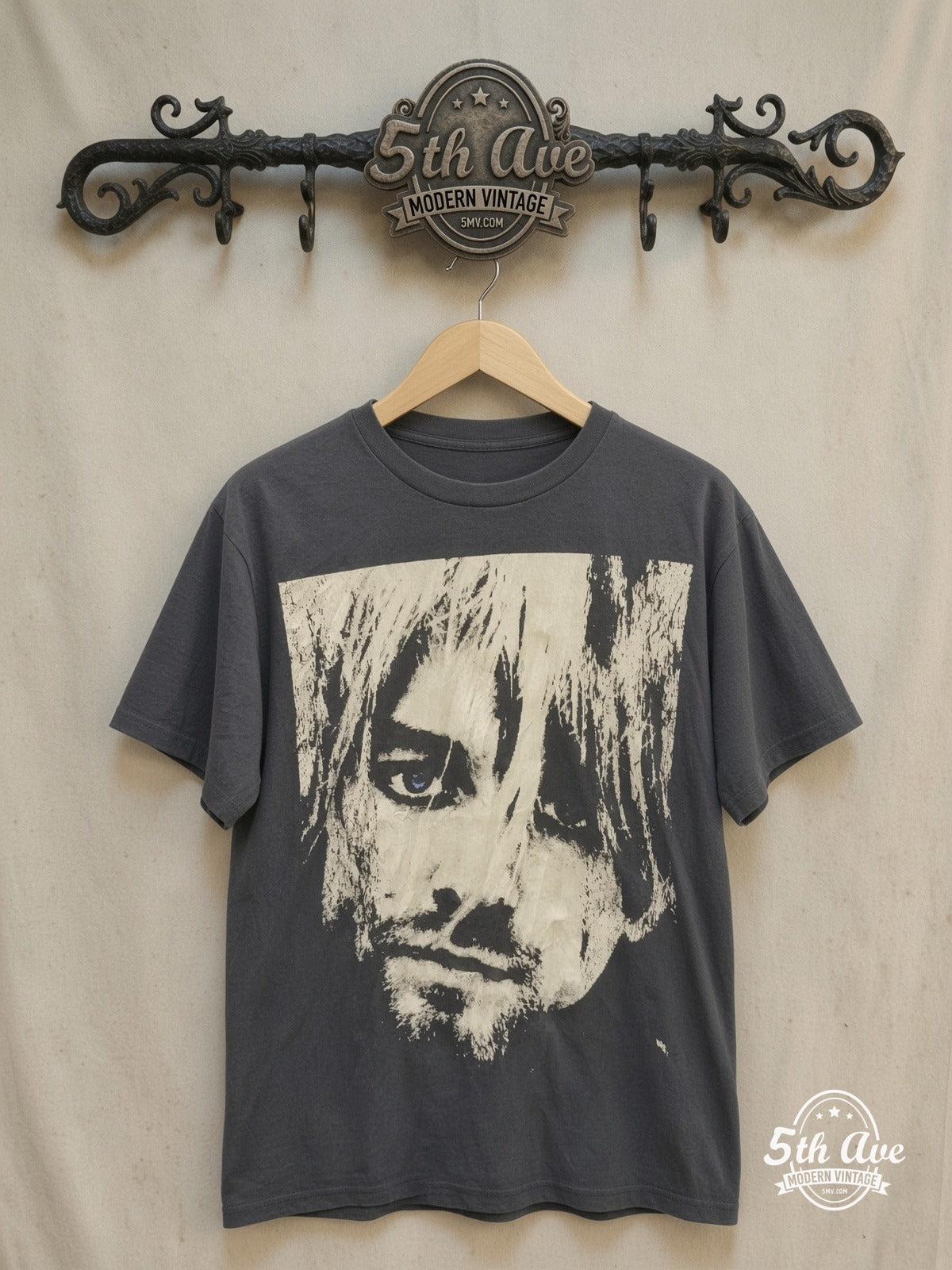 Nirvana – KURT COBAIN – Vintage Band T-Shirt — front on locked cream ornate 5th Ave rack