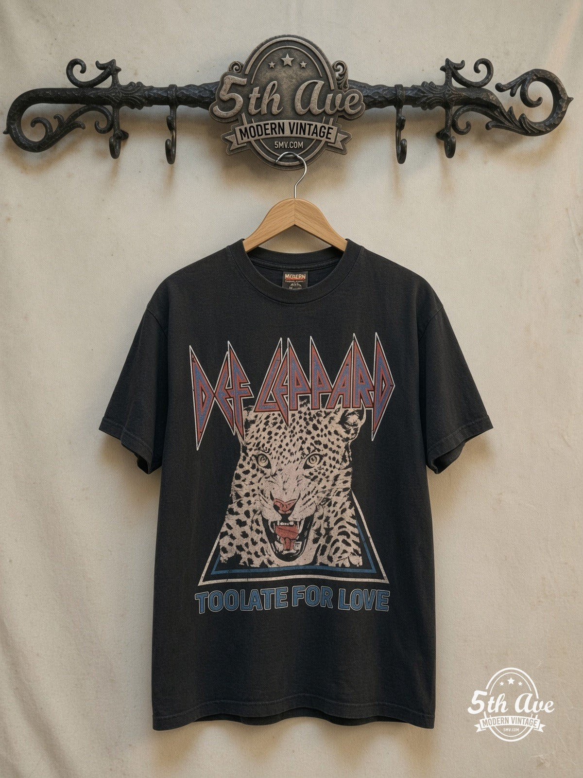 Def Leppard – Too Late For Love Leopard Triangle – Vintage Band T-Shirt — front on locked cream ornate 5th Ave rack