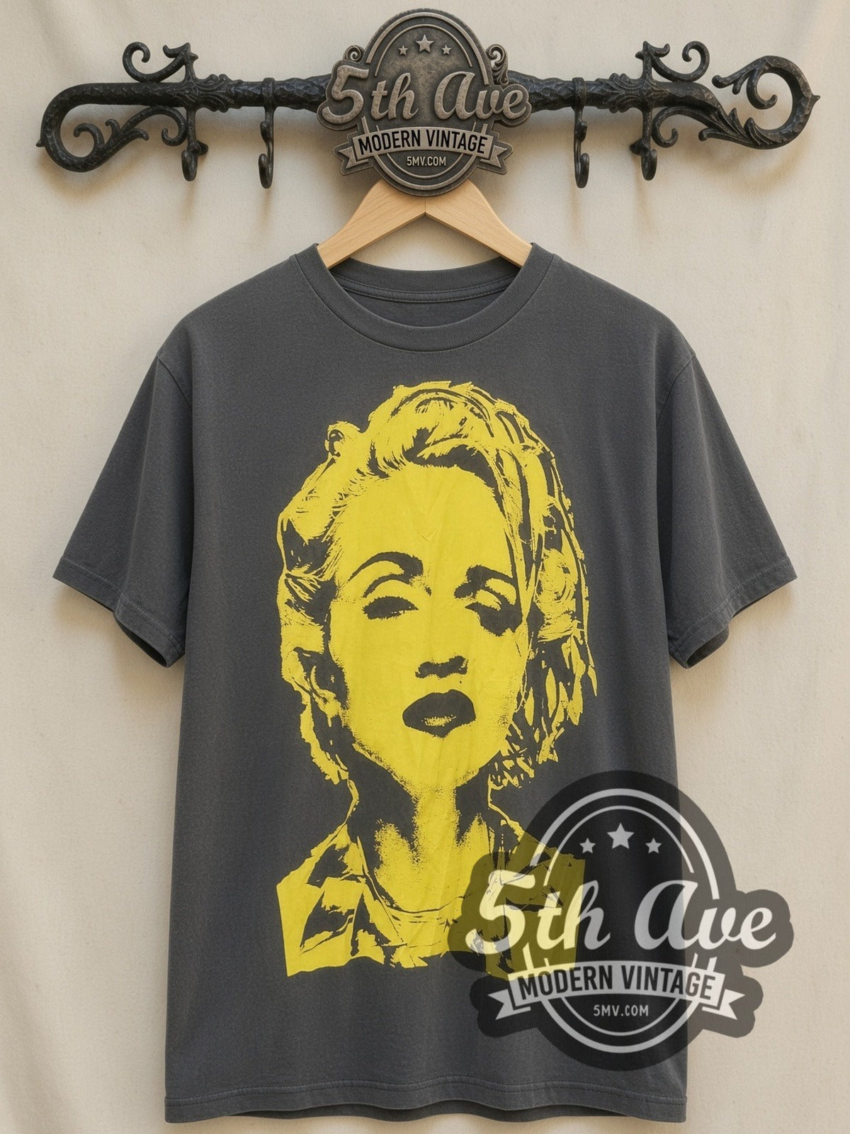 Madonna – Yellow Portrait vintage band t-shirt, front view on a display rack
