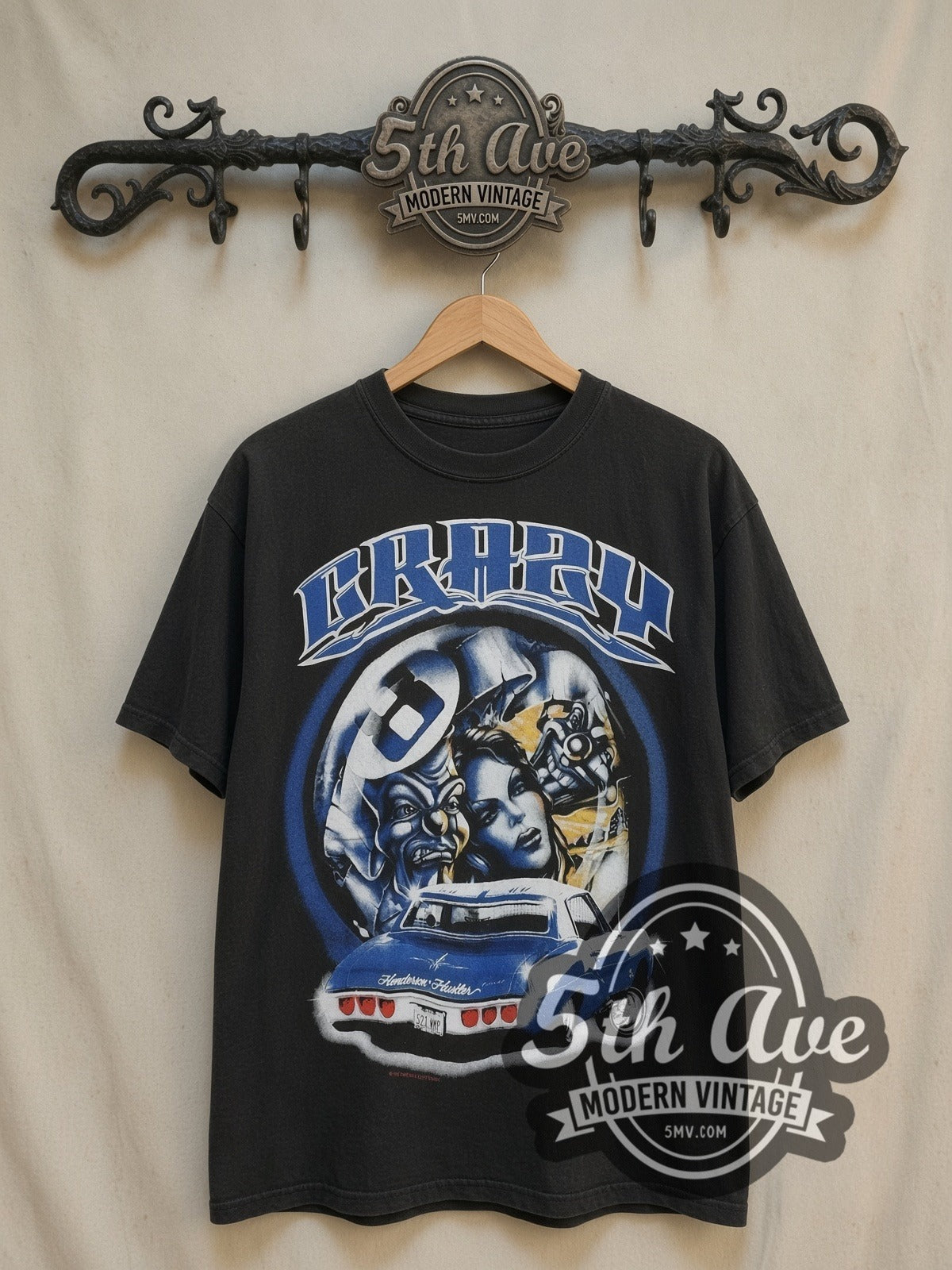 Crazy Rollin Hard Lowrider vintage graphic tee, front view on a display rack