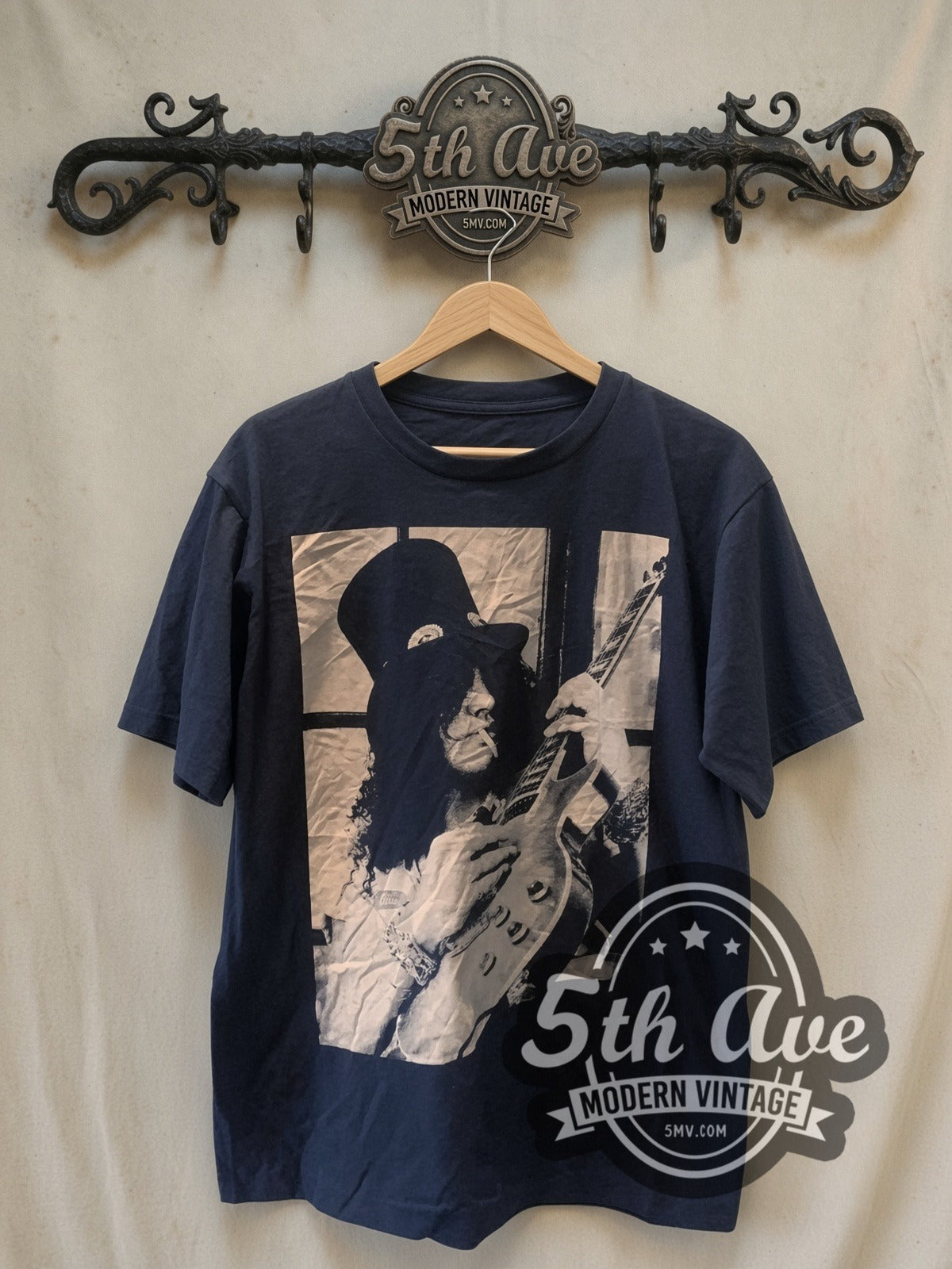 Slash Guns N' Roses vintage band t-shirt, front view on a display rack