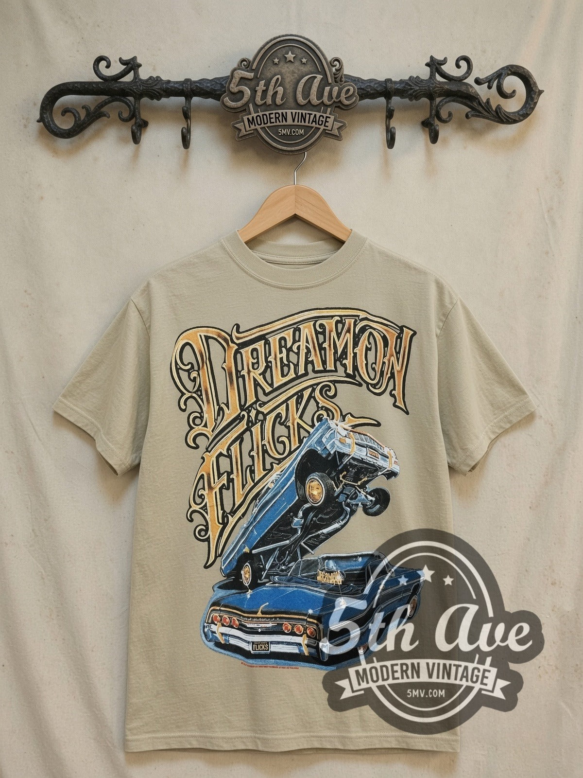 Rollin Hard Dream On Flicks Lowriders vintage graphic tee, front view on a display rack