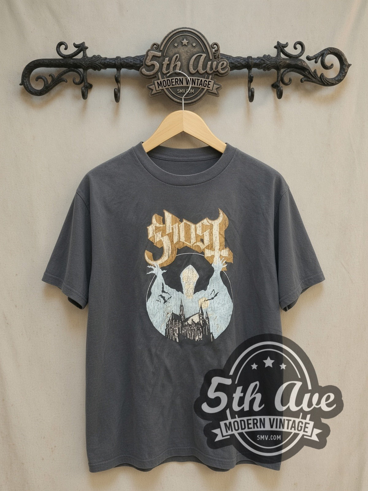 Ghost Logo and Papa Figure vintage band t-shirt, front view on a display rack