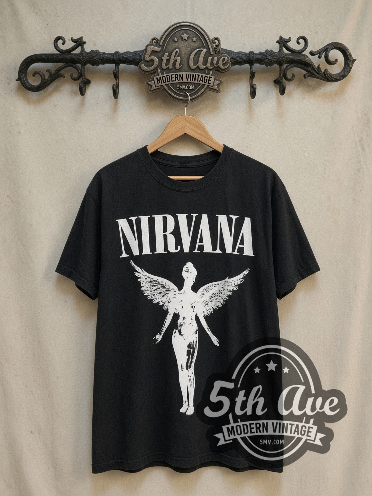 Nirvana In Utero Glow in the Dark vintage band t-shirt, front view on a display rack