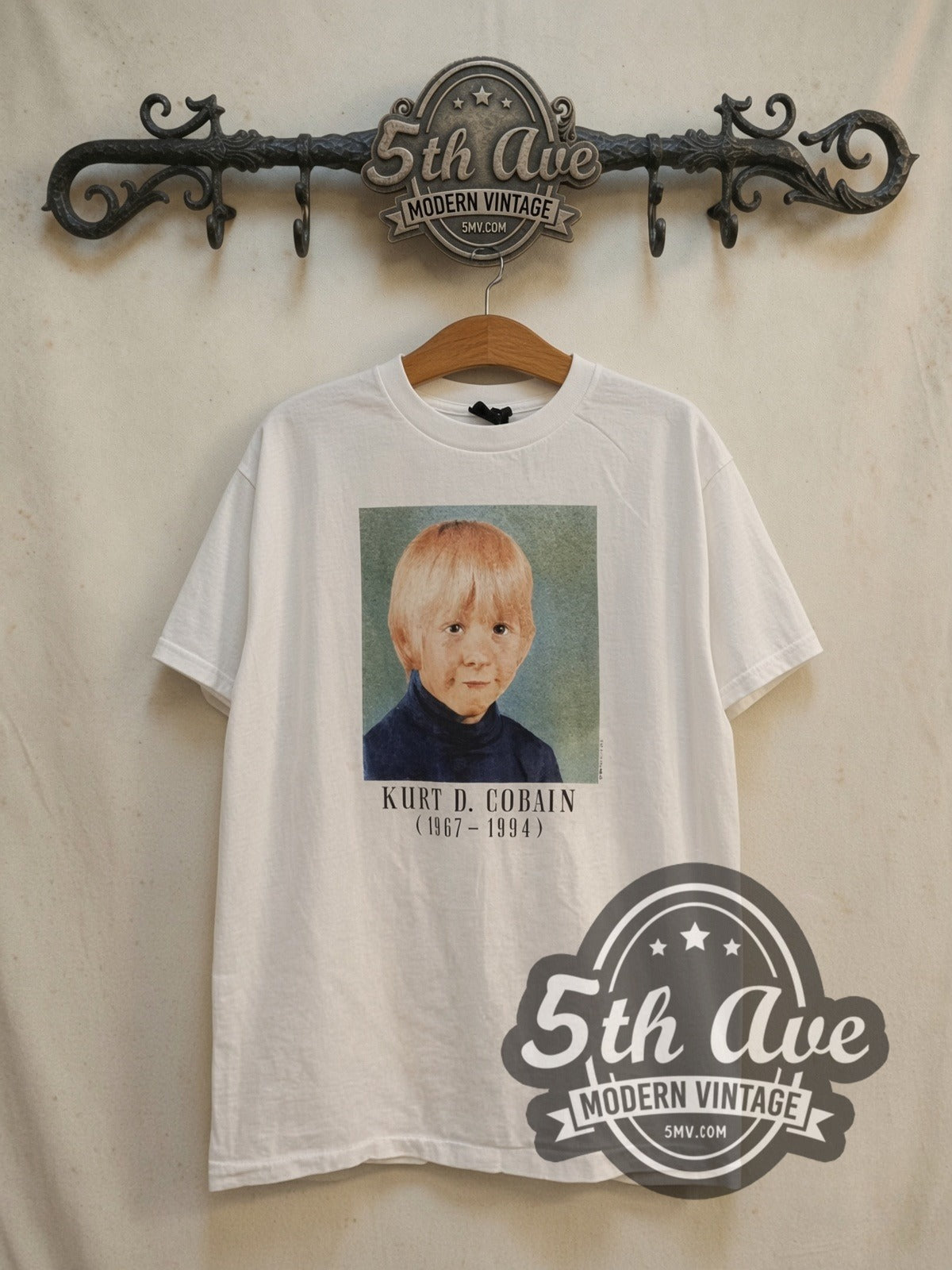 Nirvana Kurt Cobain Nirvana The sun is gone vintage band t-shirt, front view on a display rack