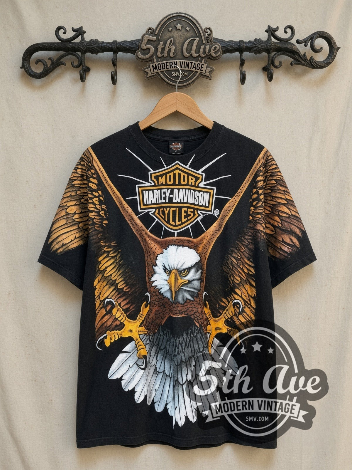 Harley-Davidson all-over-print graphic tee, front view on a display rack